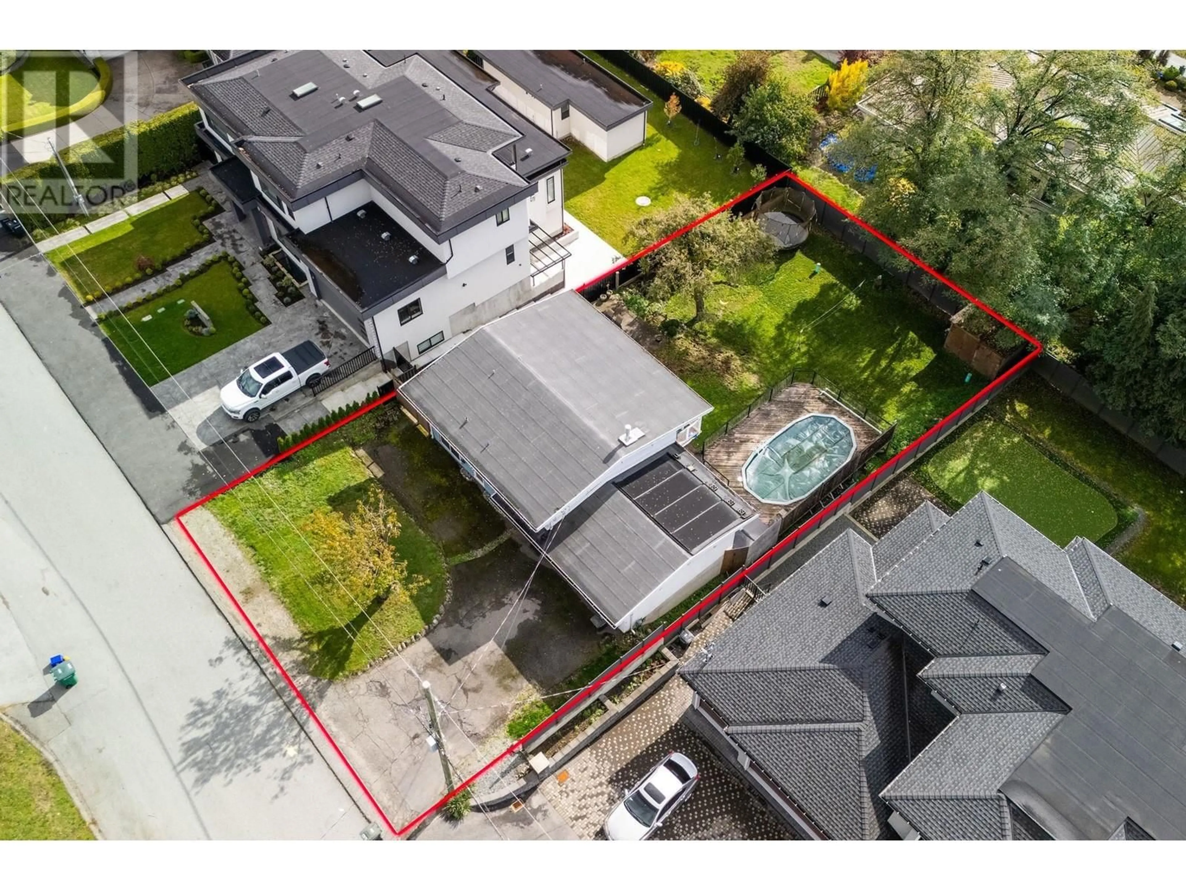 Frontside or backside of a home, the fenced backyard for 4150 IRMIN STREET, Burnaby British Columbia V5J1X5