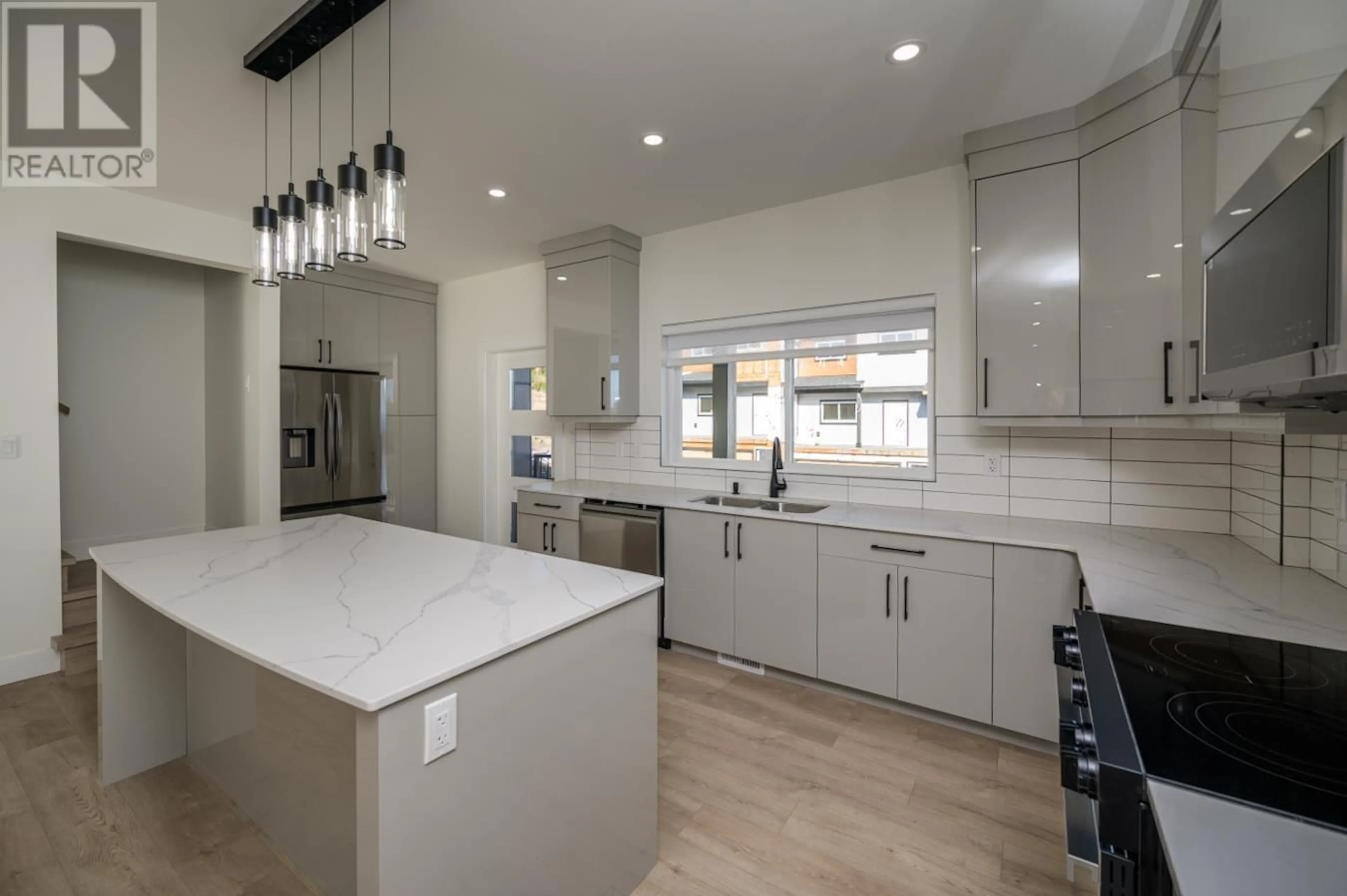 Open concept kitchen, ceramic/tile floor for 1401 - 2395 ROWE STREET, Prince George British Columbia V2N0J3