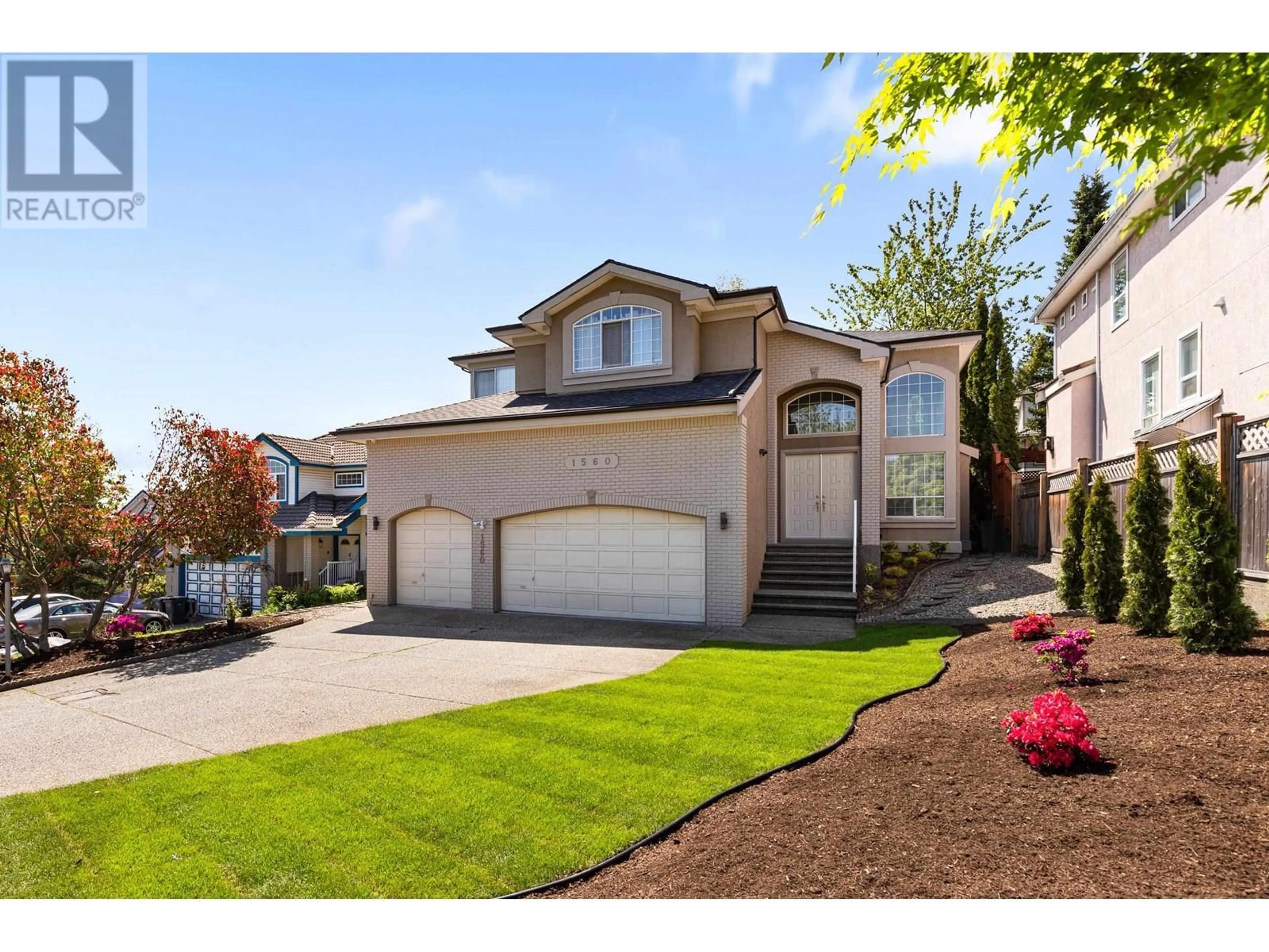 Frontside or backside of a home, the fenced backyard for 1560 PINETREE WAY, Coquitlam British Columbia V3E2Z6