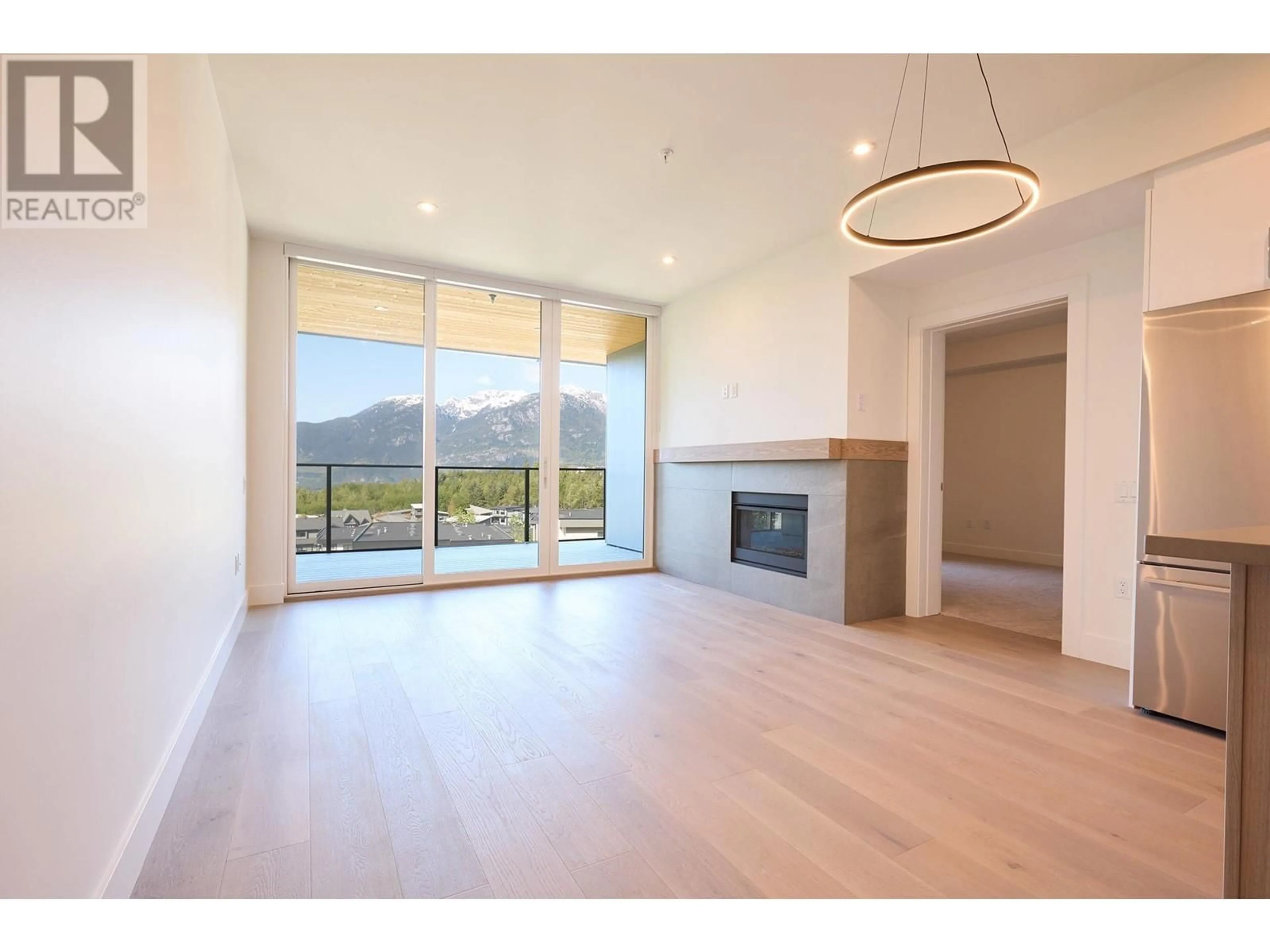 Living room, wood floors for 103 3405 MAMQUAM ROAD, Squamish British Columbia V8B1E4