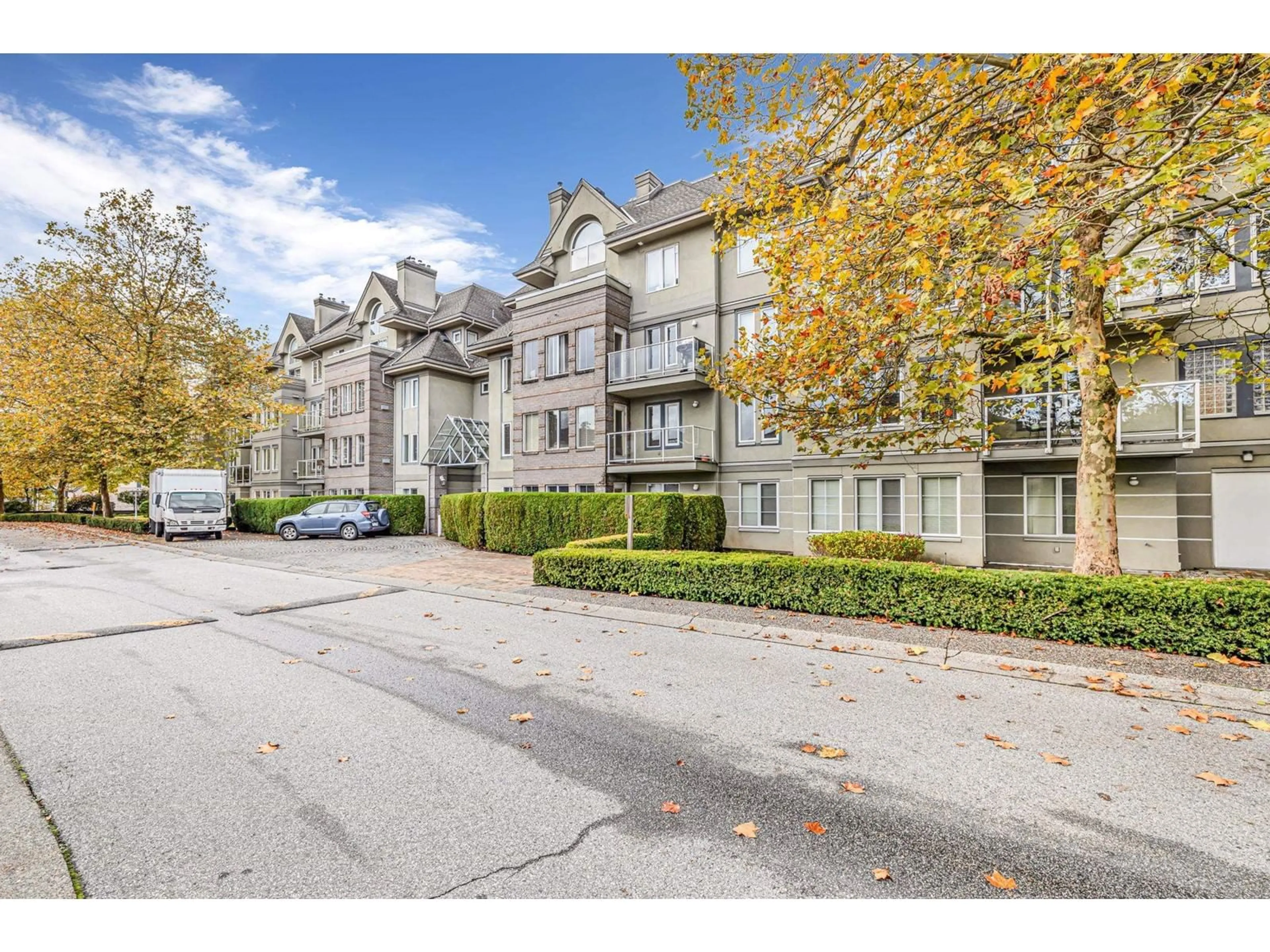 A pic from outside/outdoor area/front of a property/back of a property/a pic from drone, street for 203 - 12155 75A, Surrey British Columbia V3W1B9