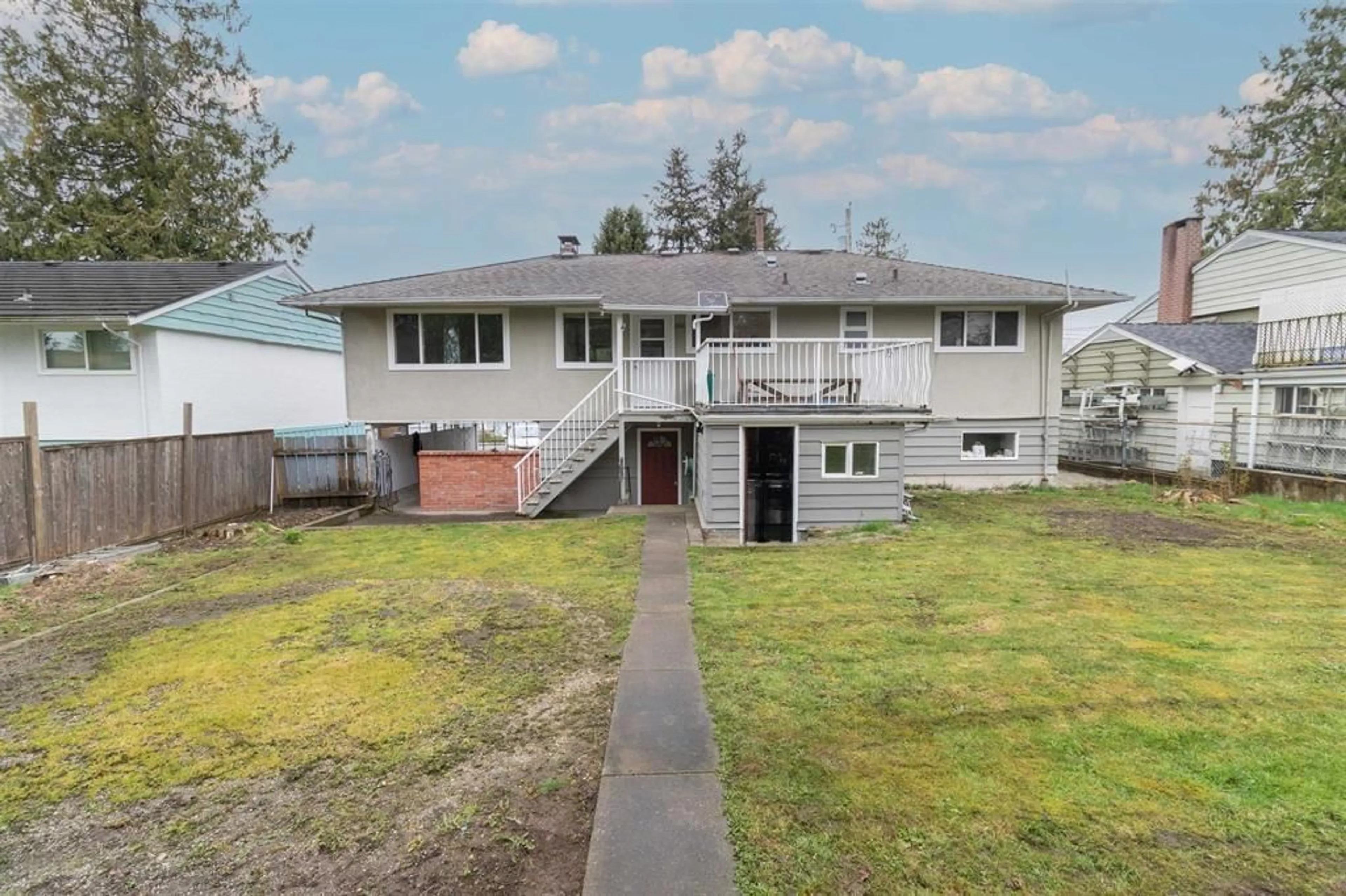 Frontside or backside of a home, the fenced backyard for 11524 97A AVENUE, Surrey British Columbia V3V2G2