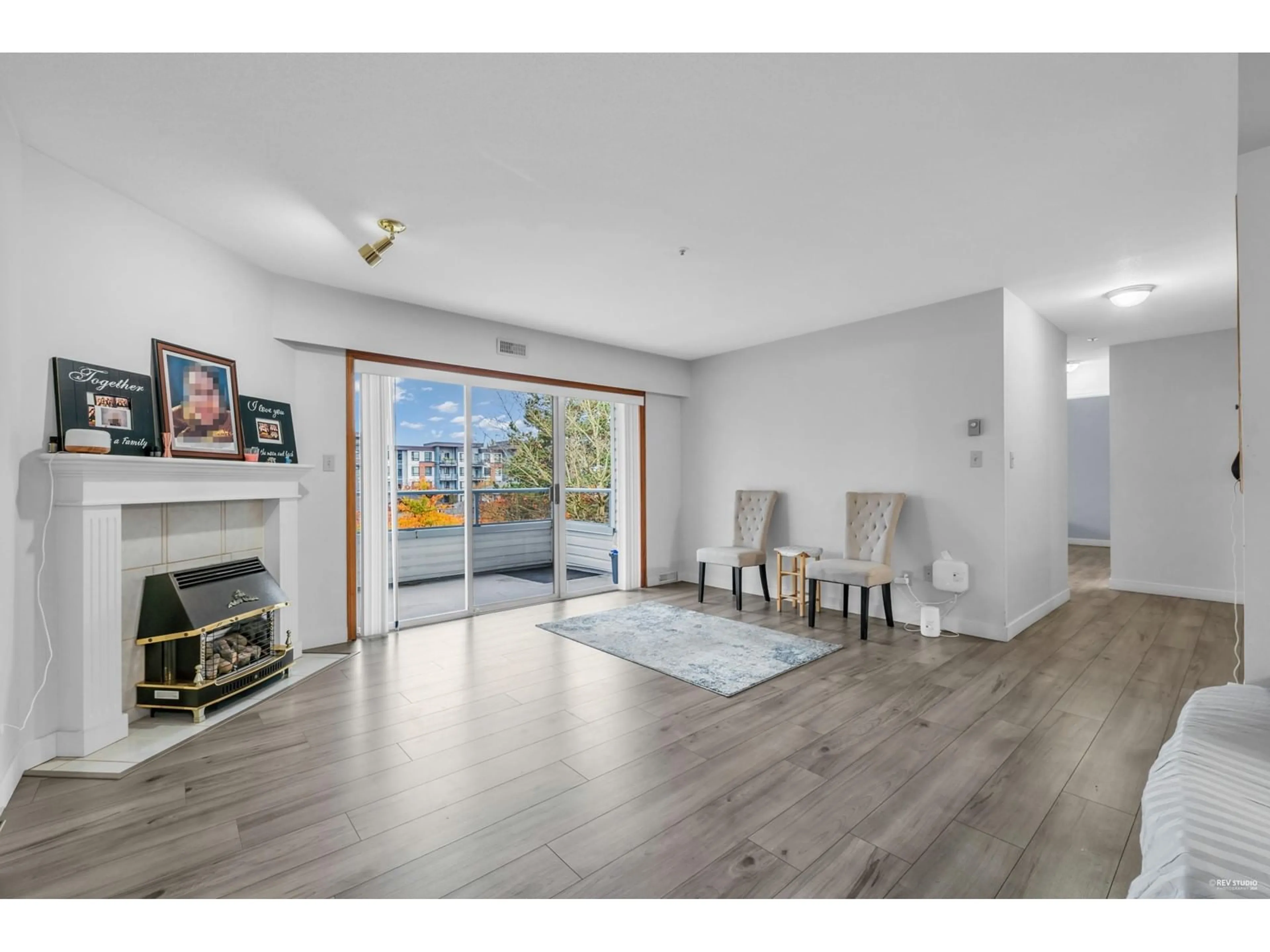 A pic of a room, wood floors for 203 5377 201A STREET, Langley British Columbia V3A1S7