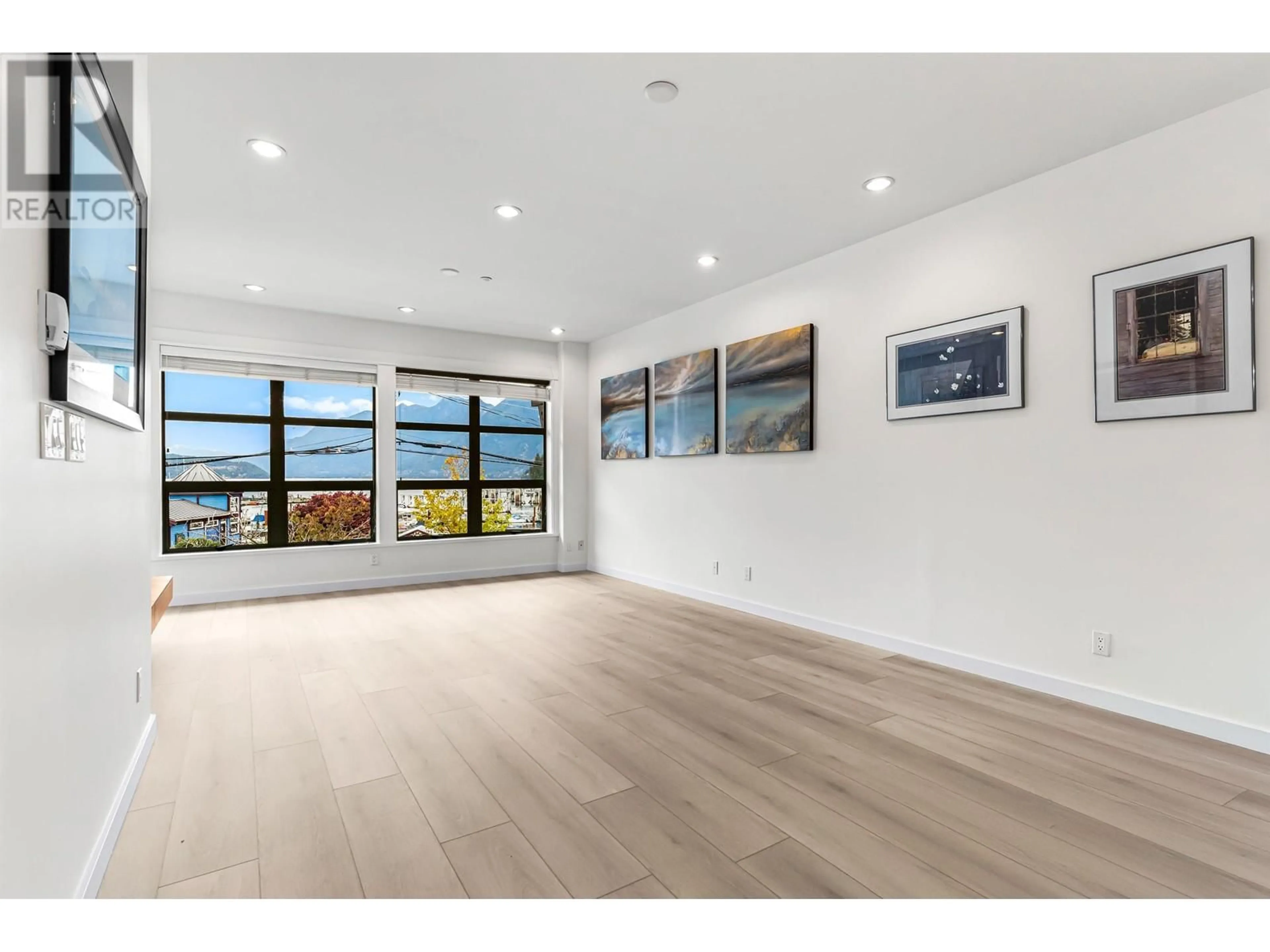 A pic of a room, wood floors for 201 6688 ROYAL AVENUE, West Vancouver British Columbia V7W2B9