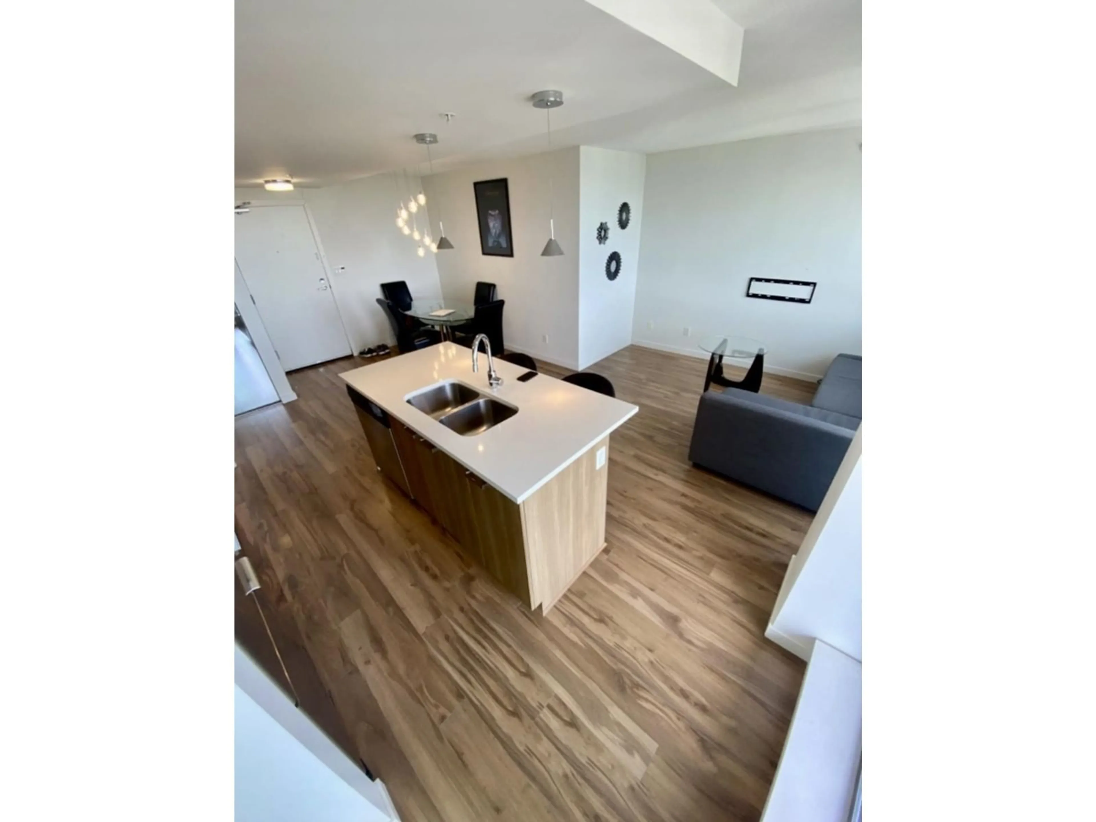 A pic of a room, wood floors for 3309 13325 102A AVENUE, Surrey British Columbia V3T0J5