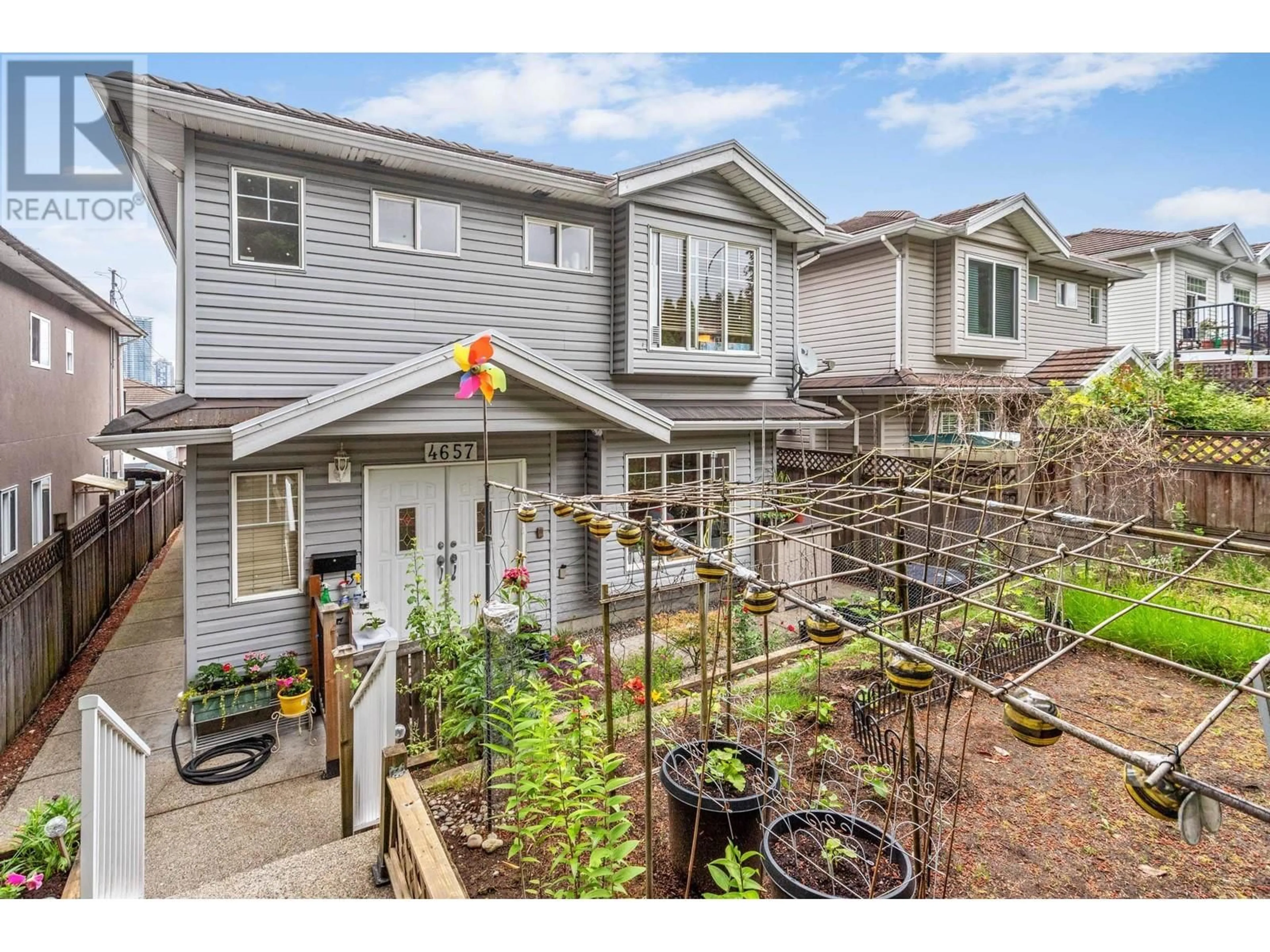 A pic from exterior of the house or condo, the fenced backyard for 4657 CANADA WAY, Burnaby British Columbia V5G1K9