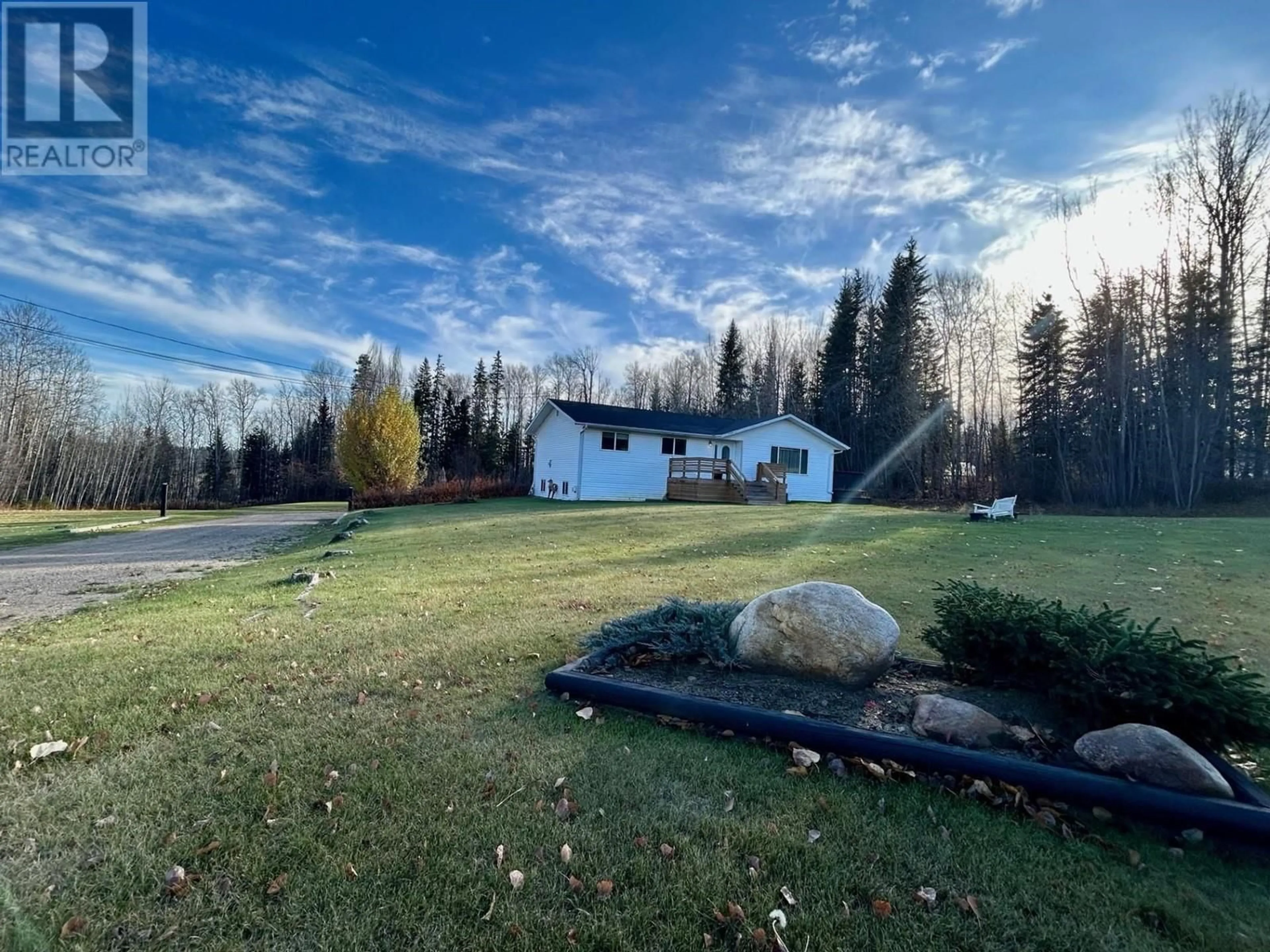 A pic from outside/outdoor area/front of a property/back of a property/a pic from drone, mountain view for 27 RAVEN CRESCENT, Fort Nelson British Columbia V0C1R0