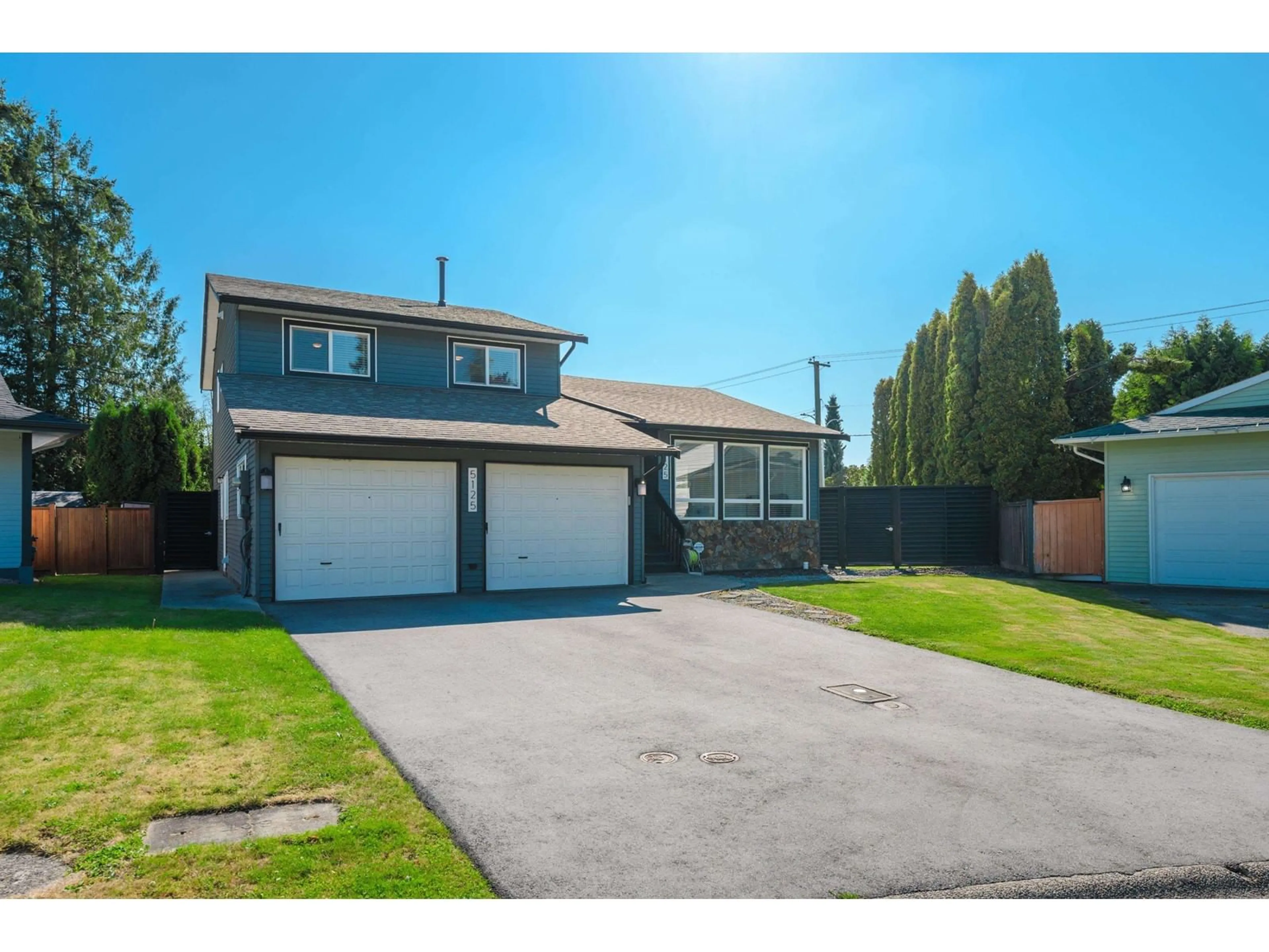 Frontside or backside of a home, the fenced backyard for 5125 208A STREET, Langley British Columbia V3A7L9