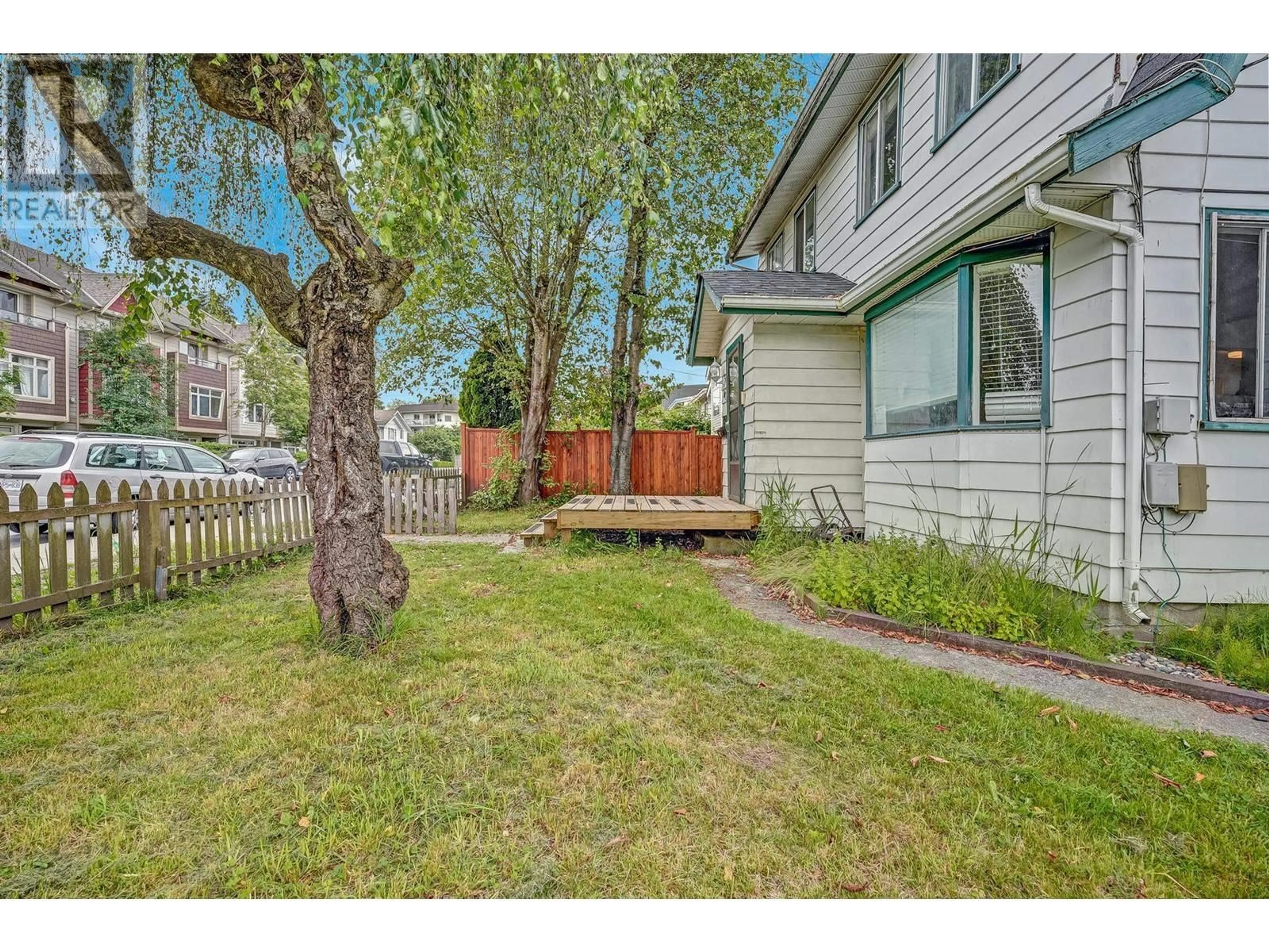 Frontside or backside of a home, the fenced backyard for 2015 FRASER AVENUE, Port Coquitlam British Columbia V3B1N5