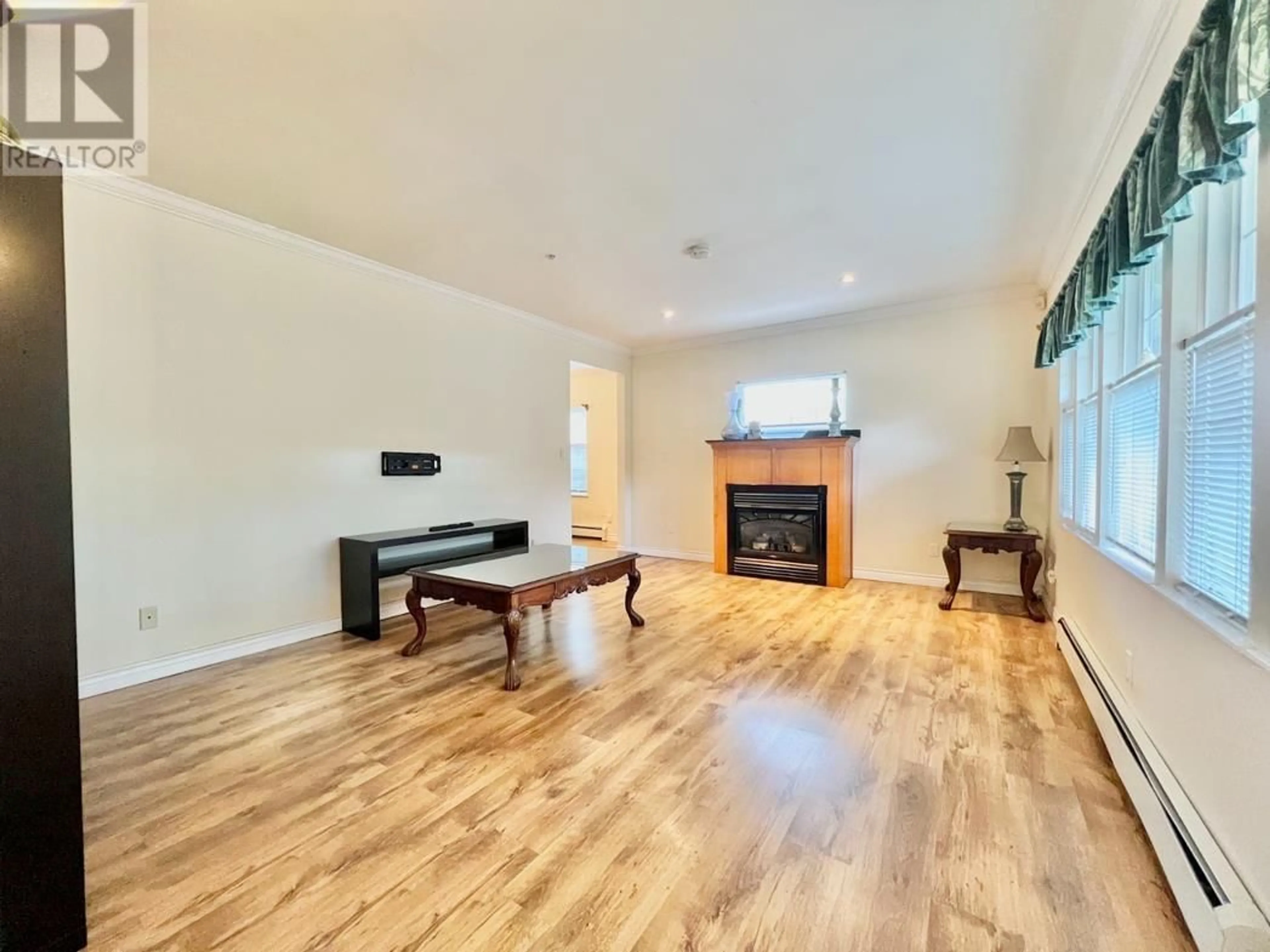 A pic of a room, wood floors for 2115-2117 W 15TH AVENUE, Vancouver British Columbia V6K2Y4