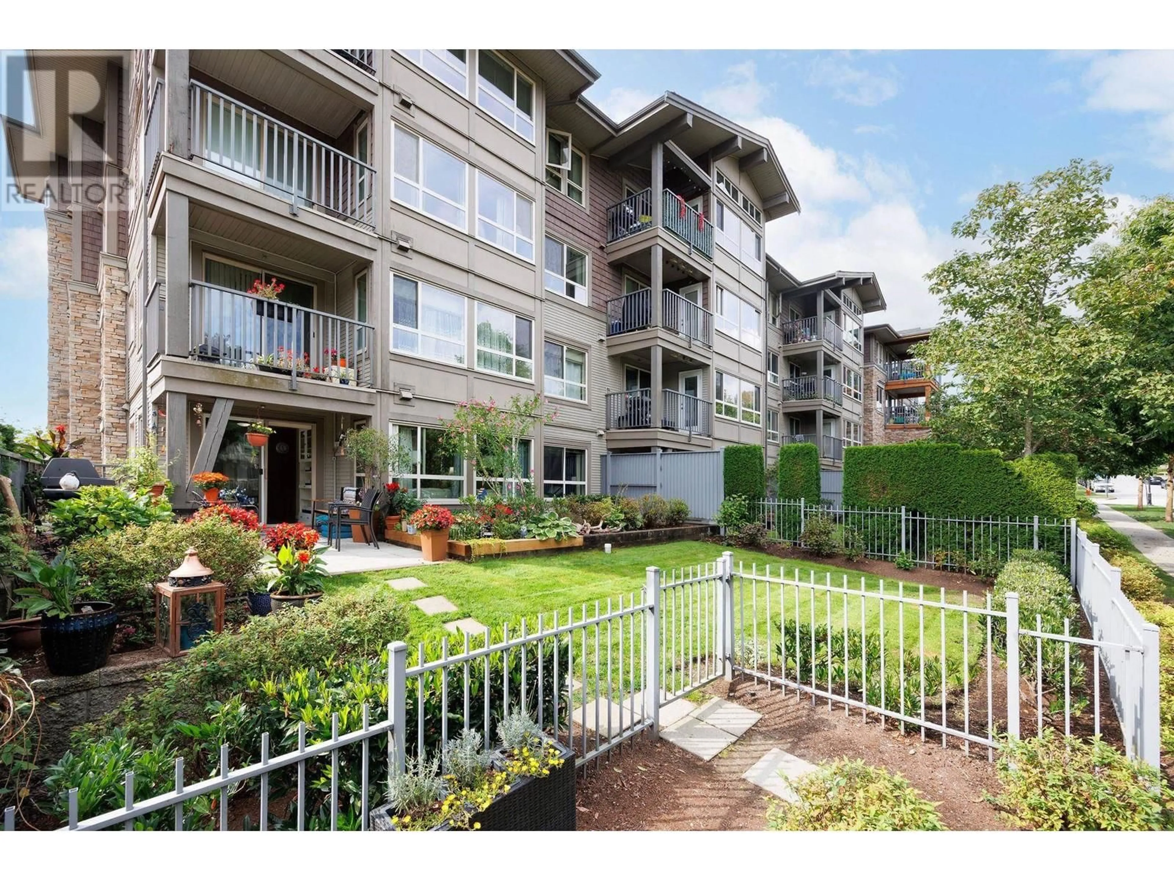 A pic from exterior of the house or condo, the fenced backyard for 203 3110 DAYANEE SPRINGS BOULEVARD, Coquitlam British Columbia V3E0B4