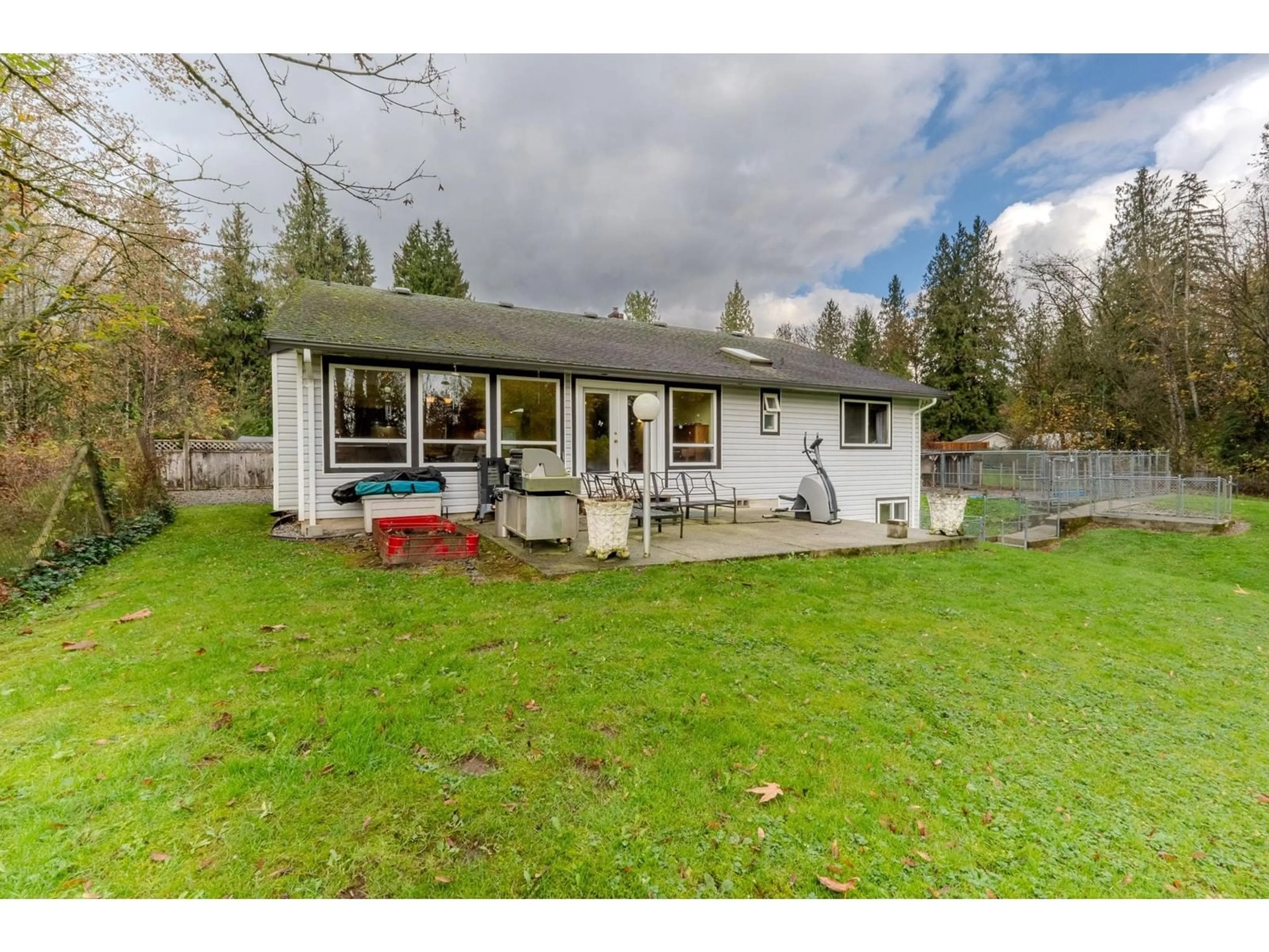 Frontside or backside of a home, the fenced backyard for 13 29605 MCTAVISH ROAD, Abbotsford British Columbia V4X2G2