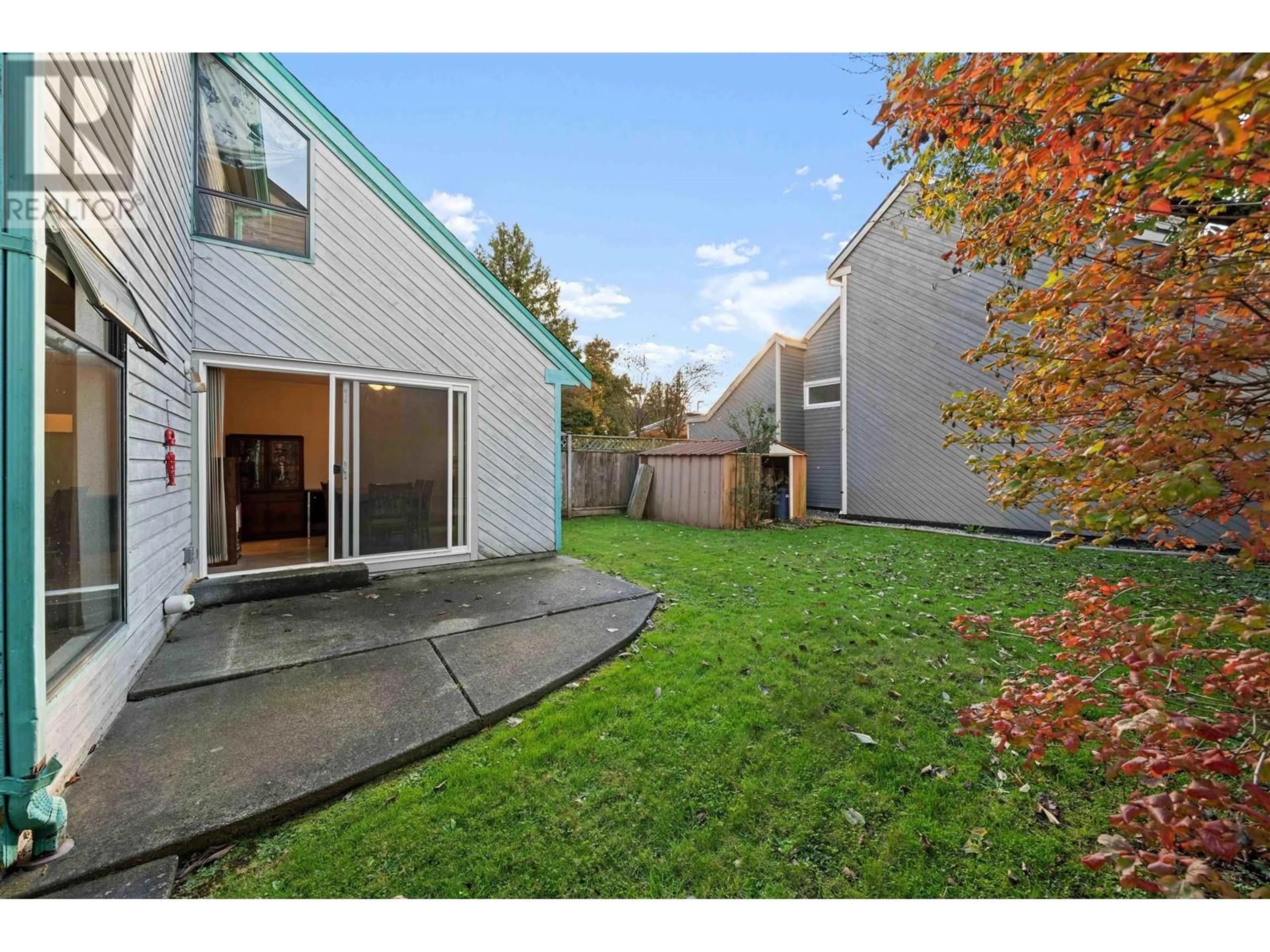 A pic from exterior of the house or condo, the fenced backyard for 4735 48B STREET, Delta British Columbia V4K4C1