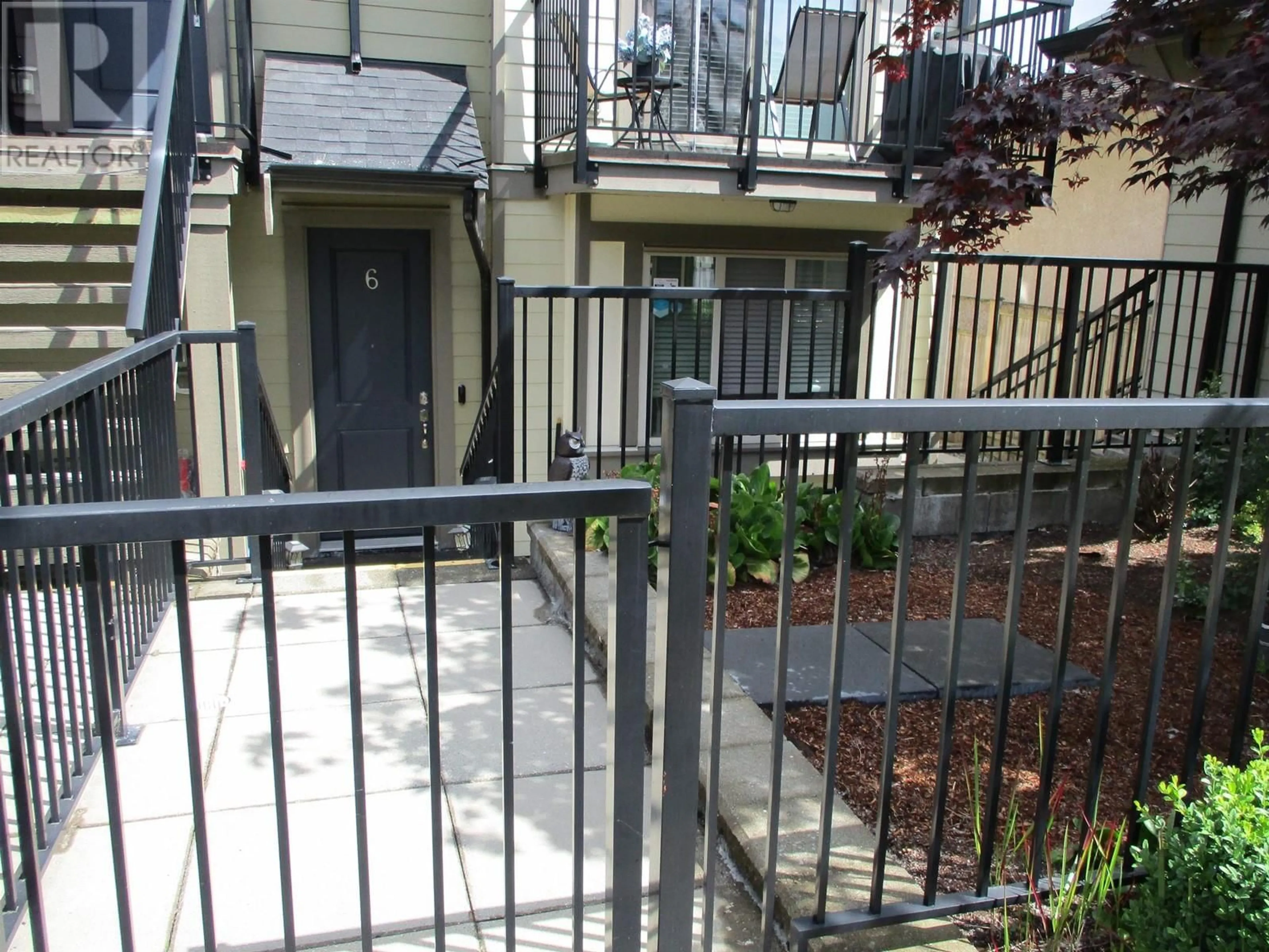 A pic from exterior of the house or condo, the fenced backyard for 6 4033 DOMINION STREET, Burnaby British Columbia V5G0C2