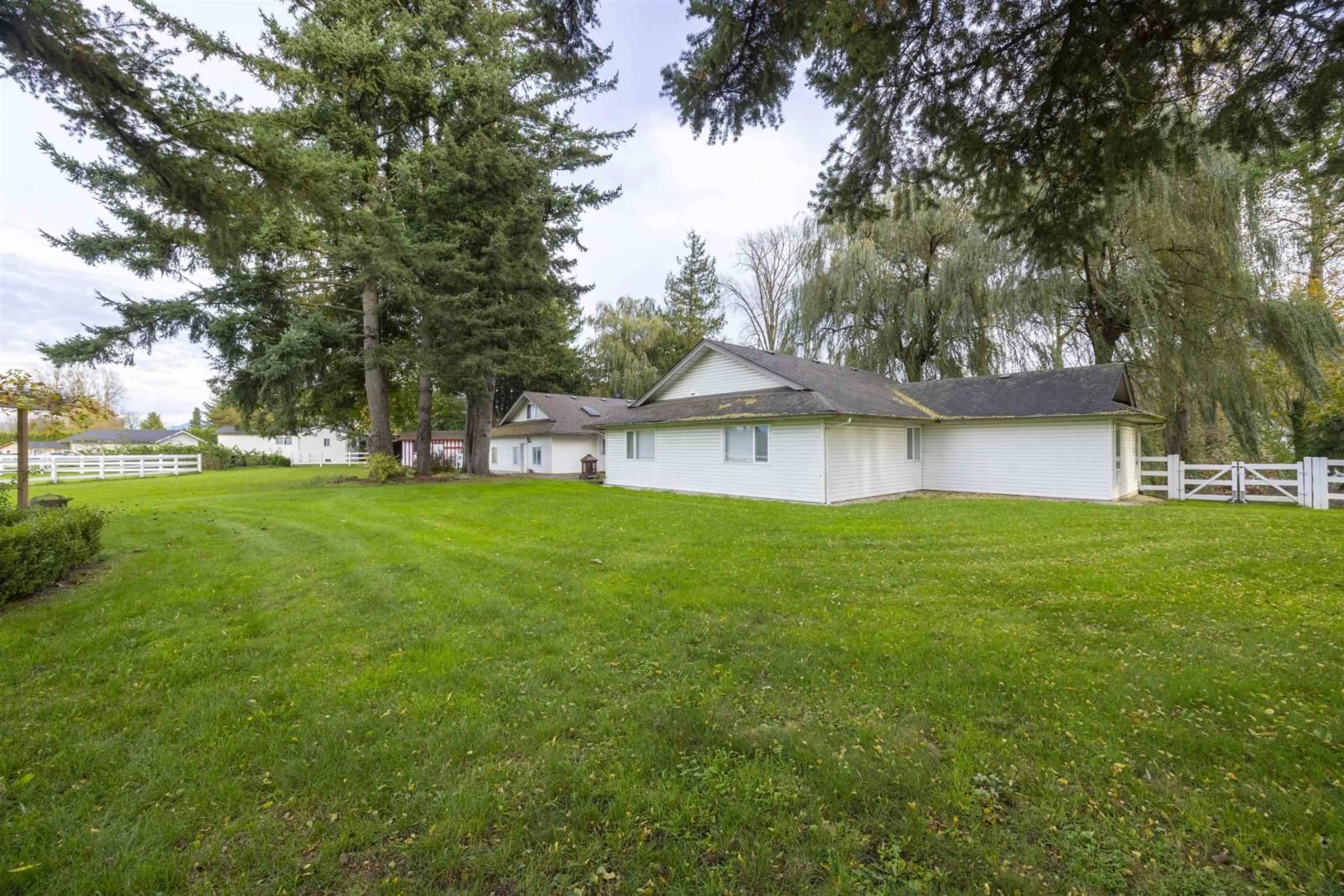 Frontside or backside of a home, the fenced backyard for 6911 CHILLIWACK RIVER ROAD, Chilliwack British Columbia V2R4M2