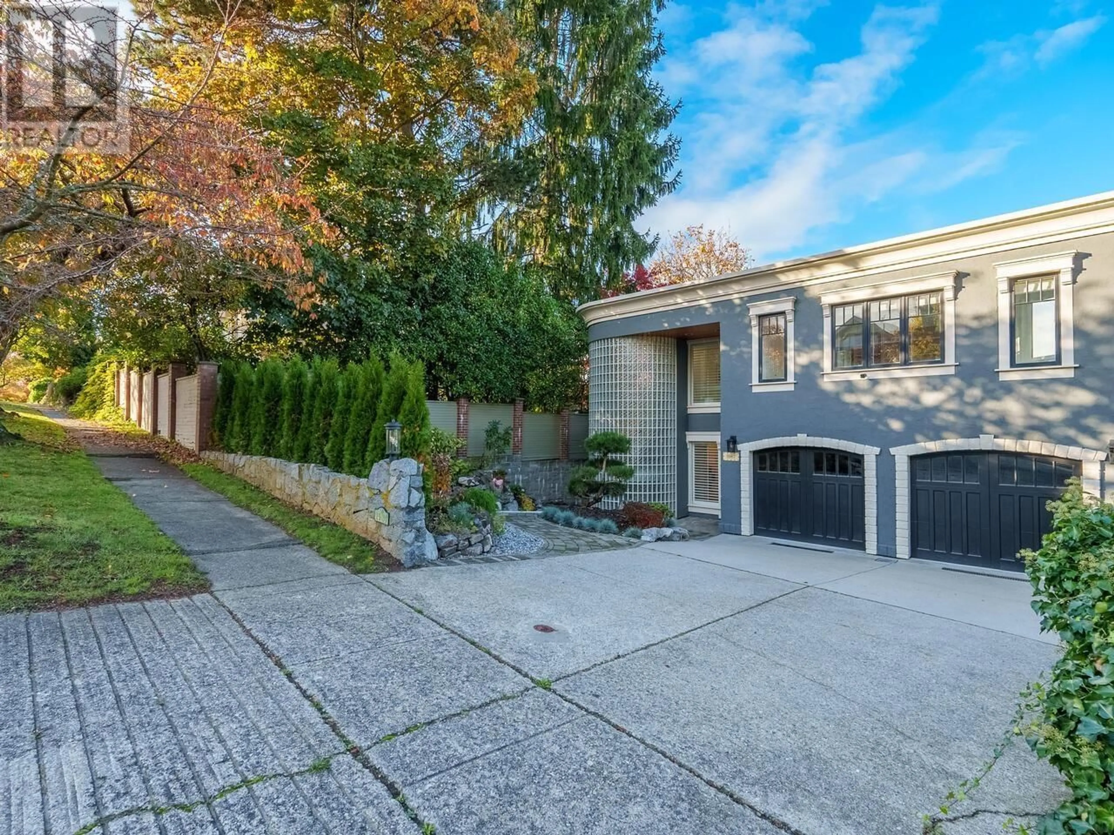 Frontside or backside of a home, the fenced backyard for 1987 W 35TH AVENUE, Vancouver British Columbia V6M1H8