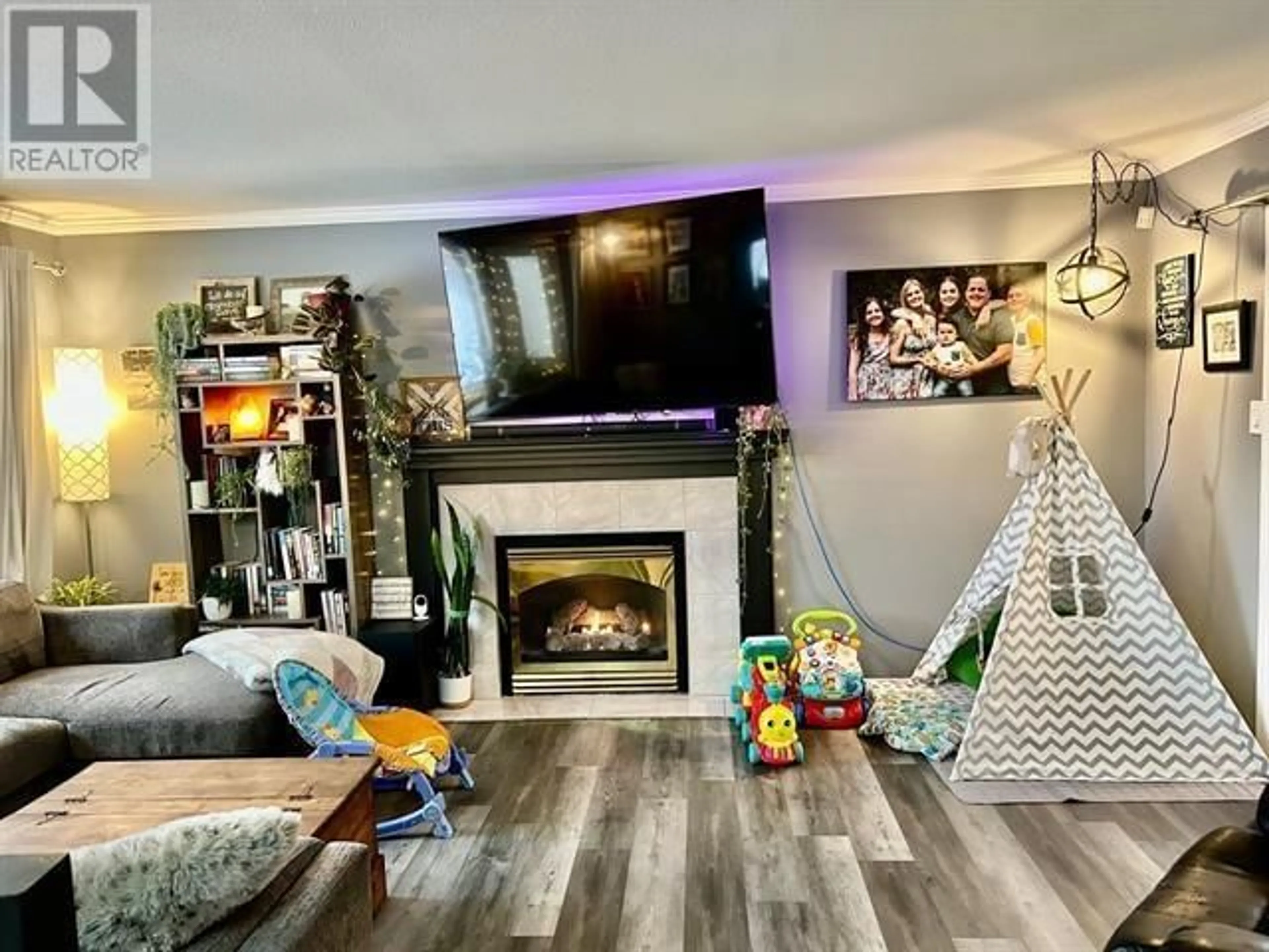 Living room, wood floors for 5604 MINNAKER CRESCENT, Fort Nelson British Columbia V0C1R0