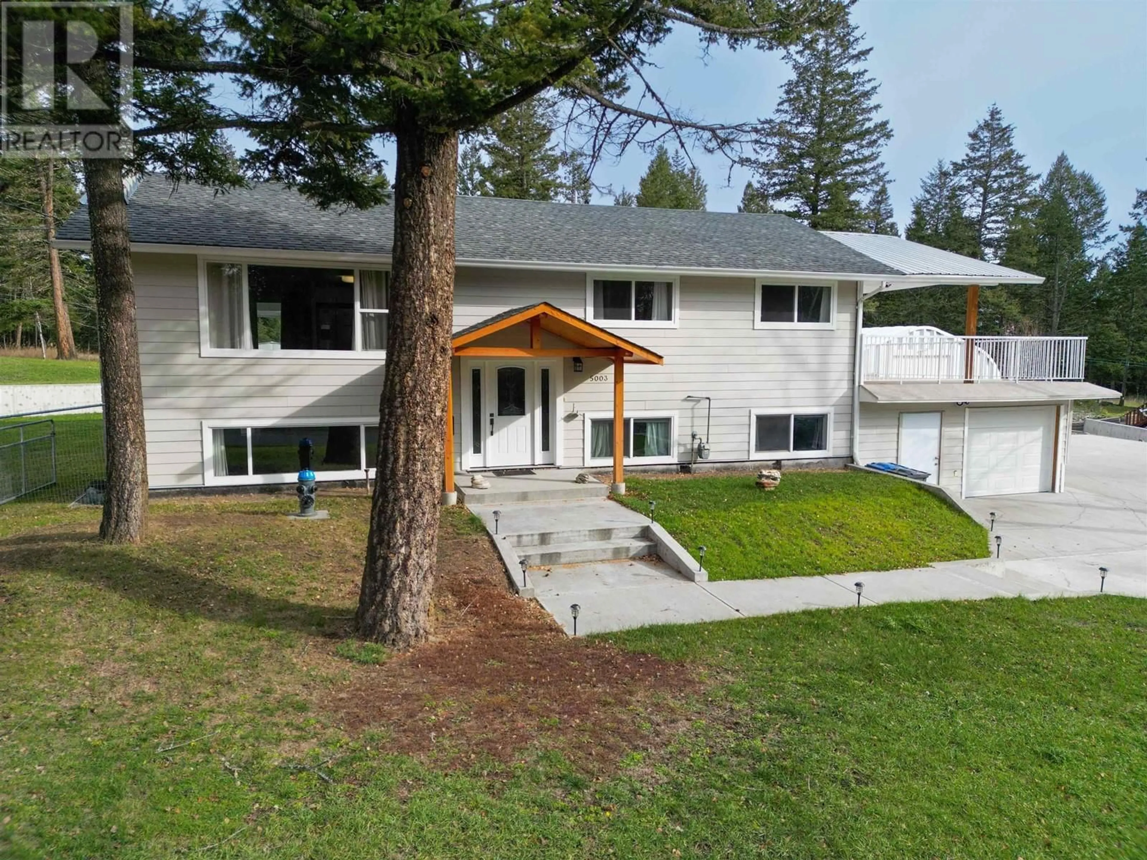 A pic from outside/outdoor area/front of a property/back of a property/a pic from drone, mountain view for 5003 SMITH ROAD, 108 Mile Ranch British Columbia V0K2Z0