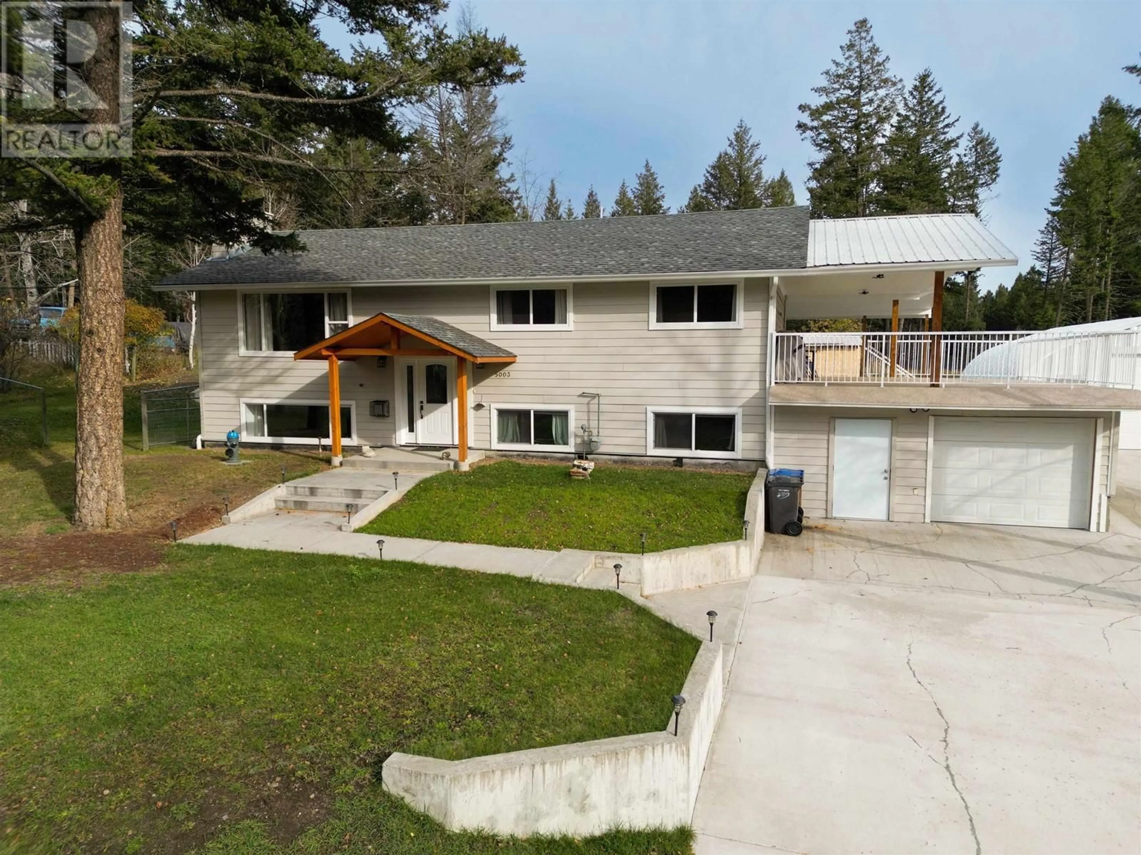 A pic from outside/outdoor area/front of a property/back of a property/a pic from drone, street for 5003 SMITH ROAD, 108 Mile Ranch British Columbia V0K2Z0