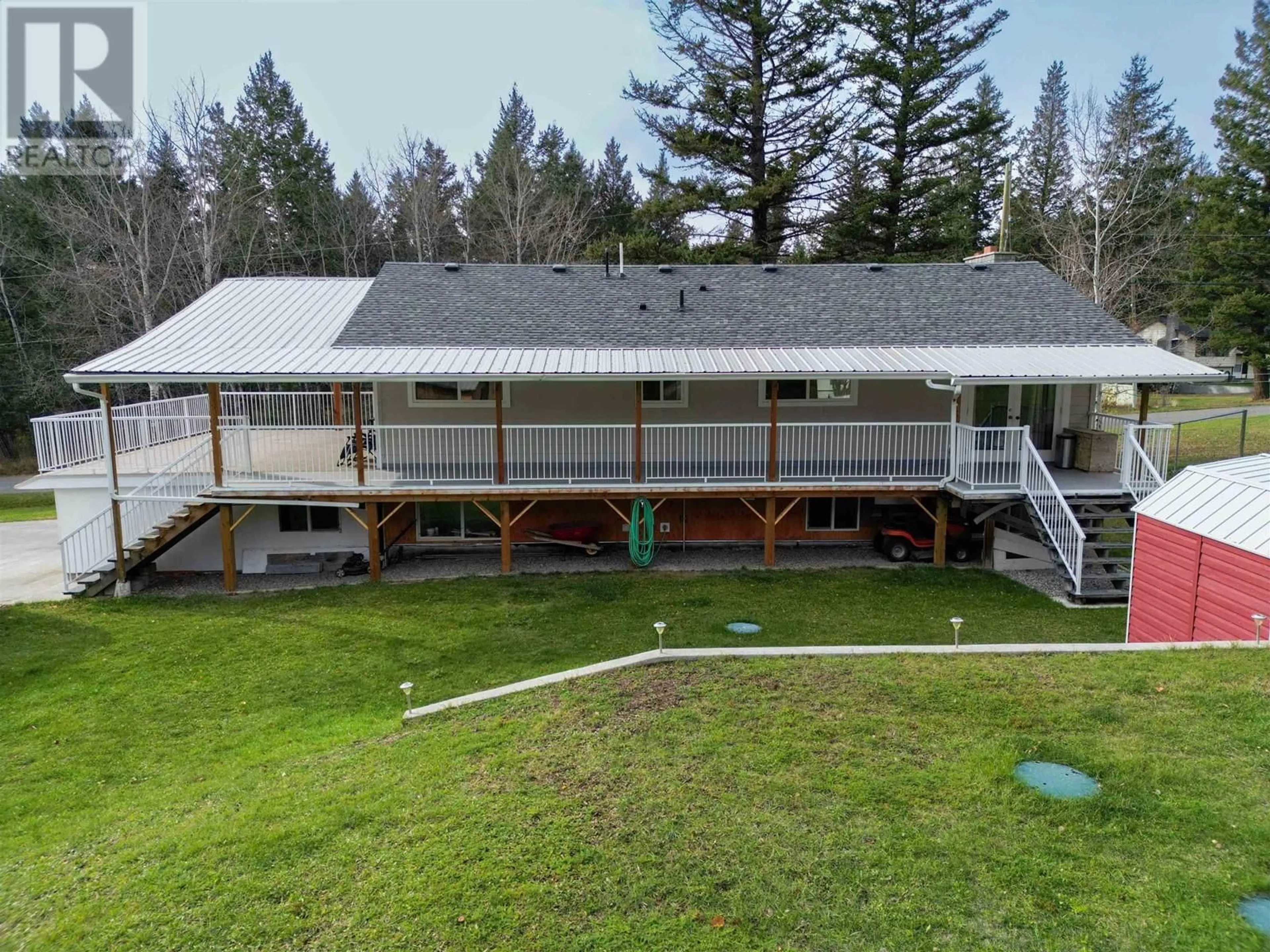 A pic from outside/outdoor area/front of a property/back of a property/a pic from drone, unknown for 5003 SMITH ROAD, 108 Mile Ranch British Columbia V0K2Z0