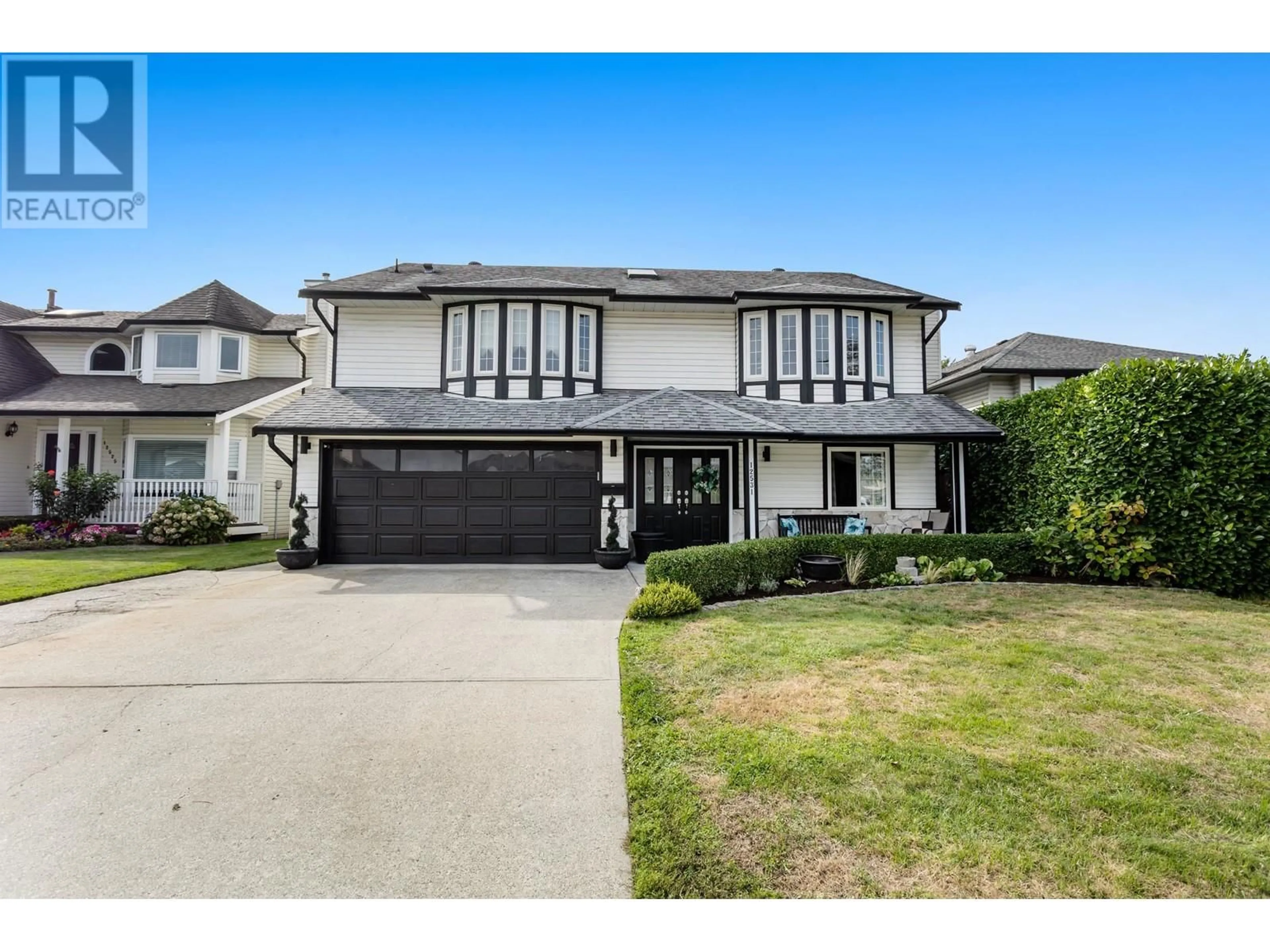 Frontside or backside of a home, the street view for 12531 220 STREET, Maple Ridge British Columbia V2X0V6