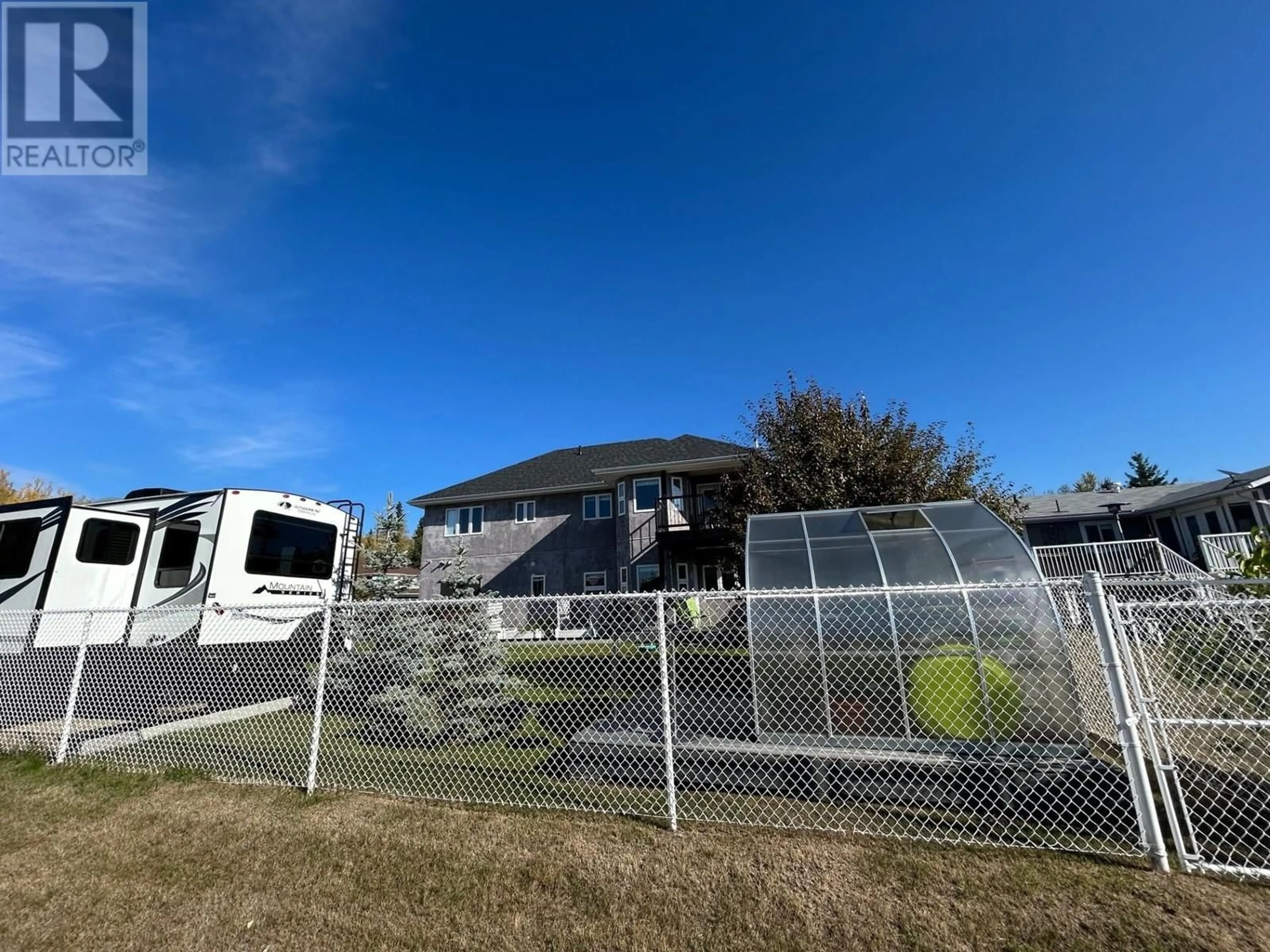 A pic from outside/outdoor area/front of a property/back of a property/a pic from drone, unknown for 5527 MINNAKER CRESCENT, Fort Nelson British Columbia V0C1R0