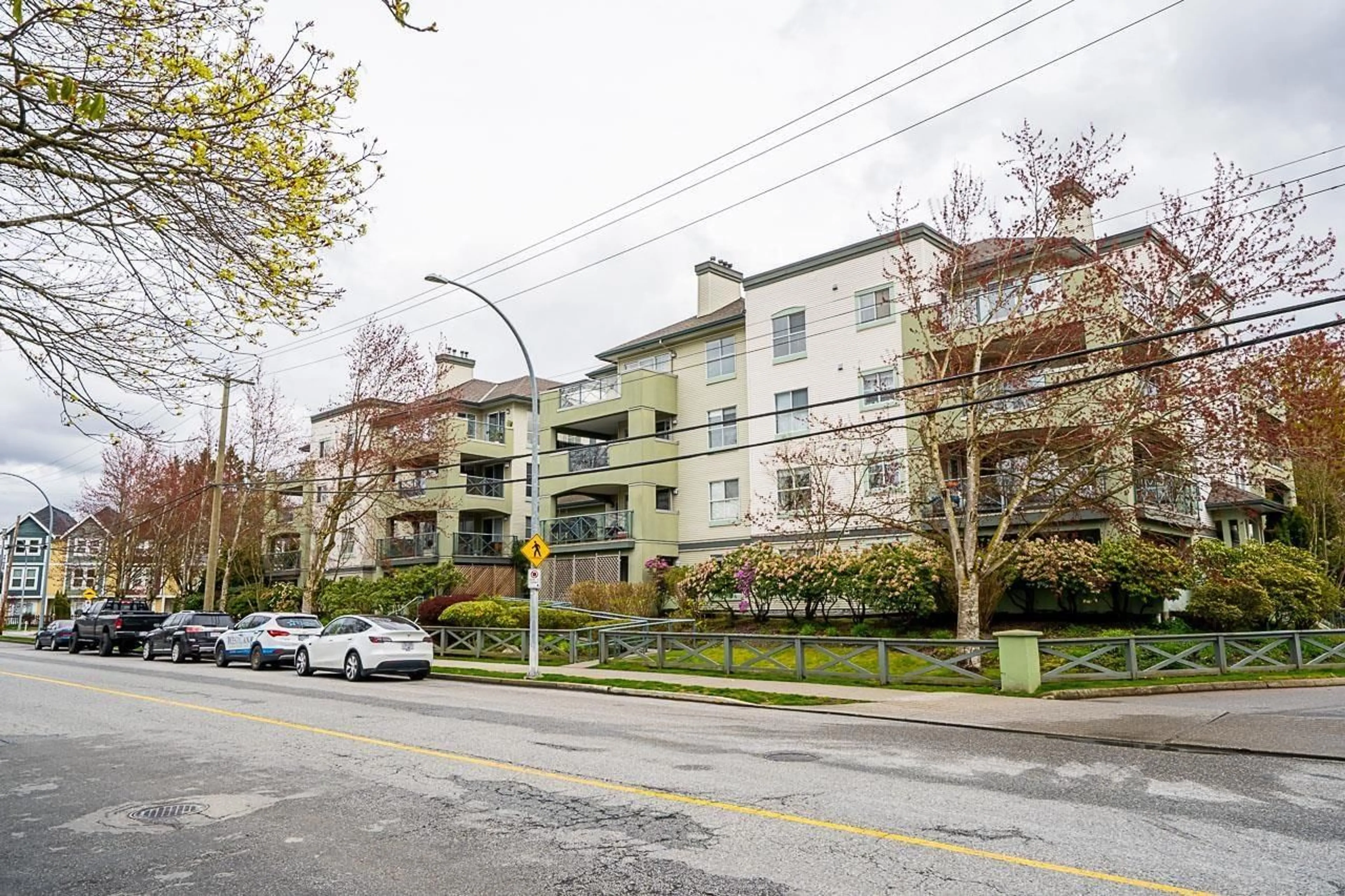 A pic from exterior of the house or condo, the street view for 407 20110 MICHAUD CRESCENT, Langley British Columbia V3A4B1