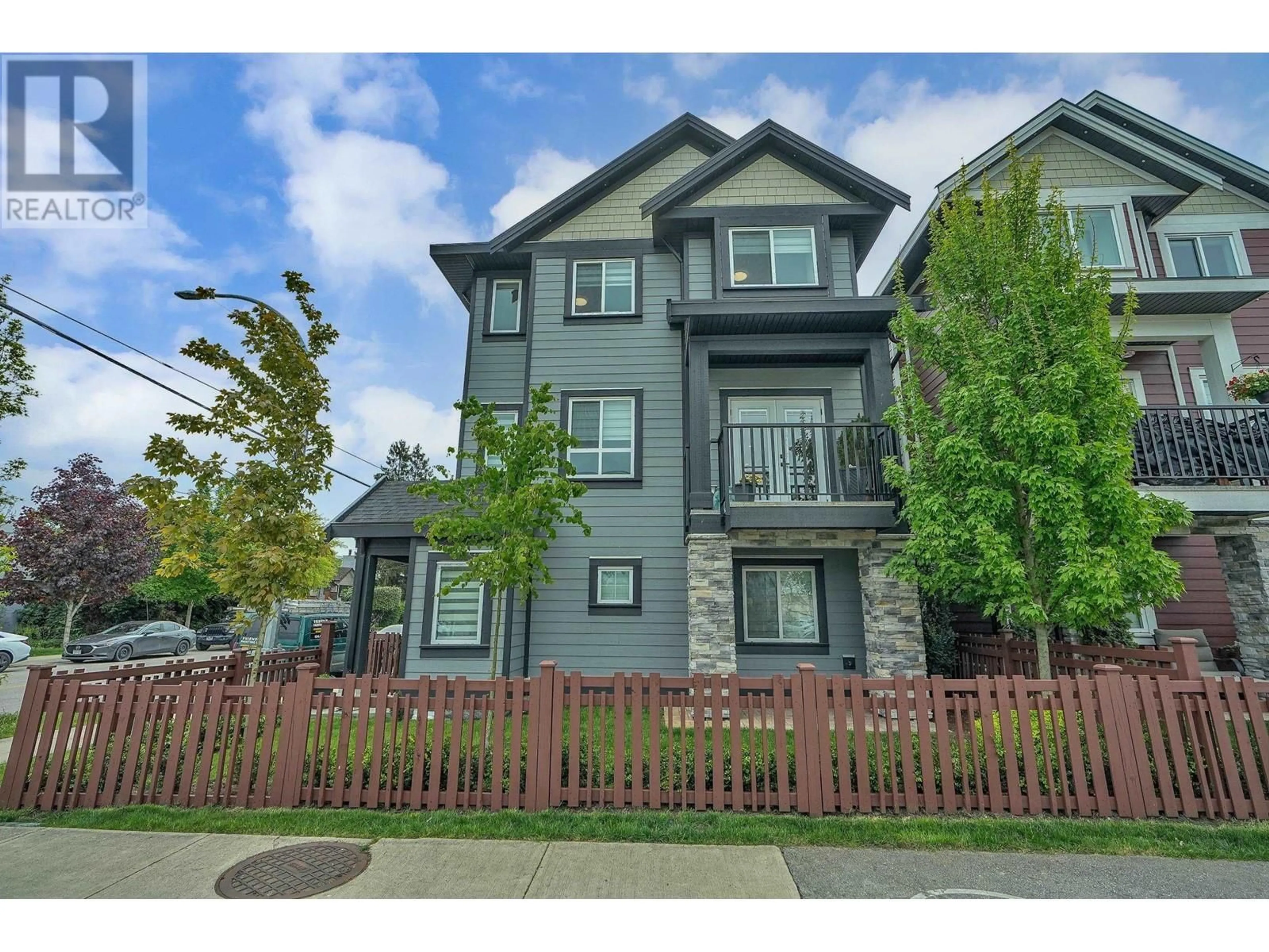 A pic from exterior of the house or condo, the fenced backyard for 1 608 EWEN AVENUE, New Westminster British Columbia V5R2S3