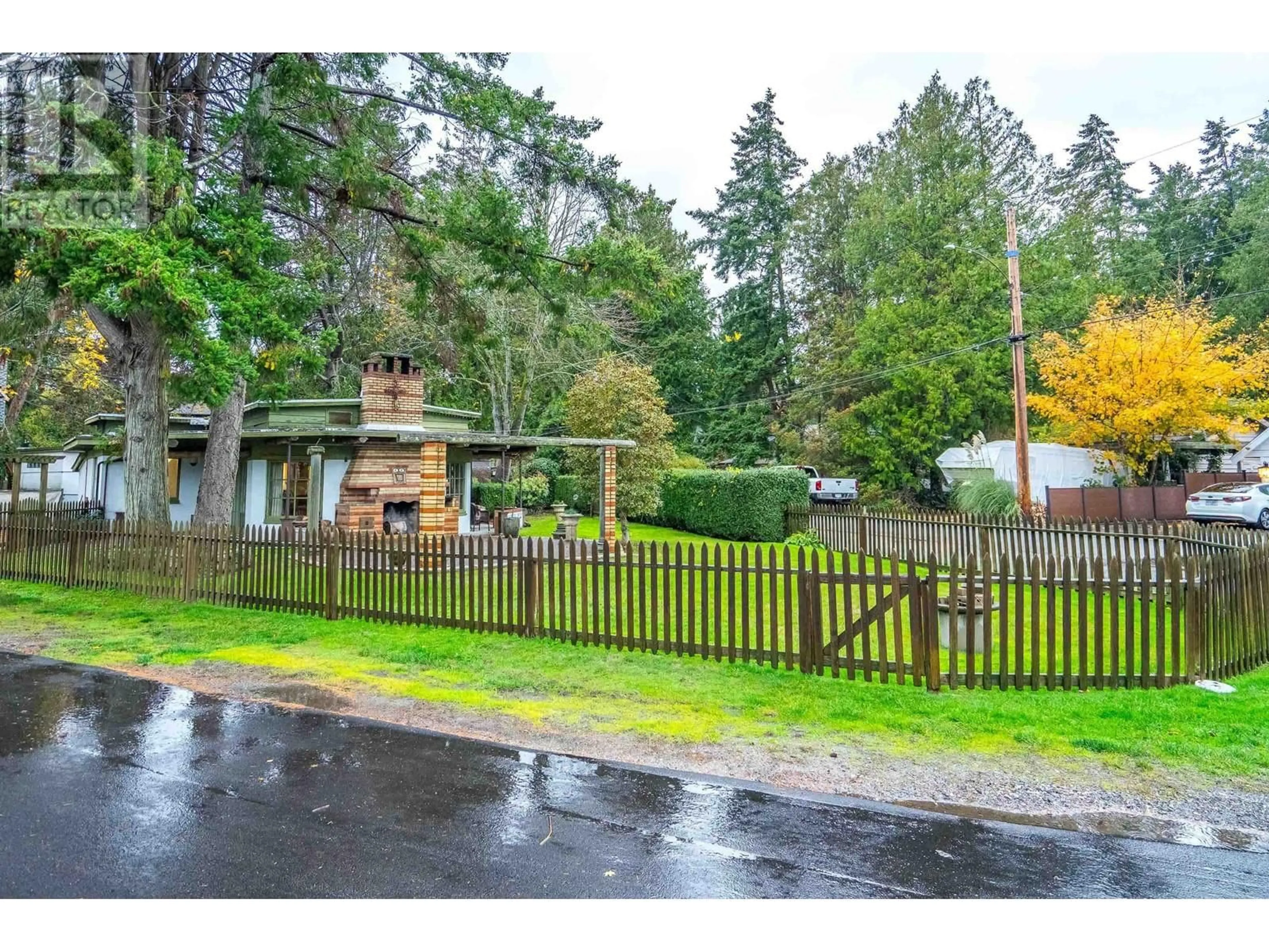 A pic from exterior of the house or condo, the fenced backyard for 5990 KIRKWOOD ROAD, Delta British Columbia V4L1G4