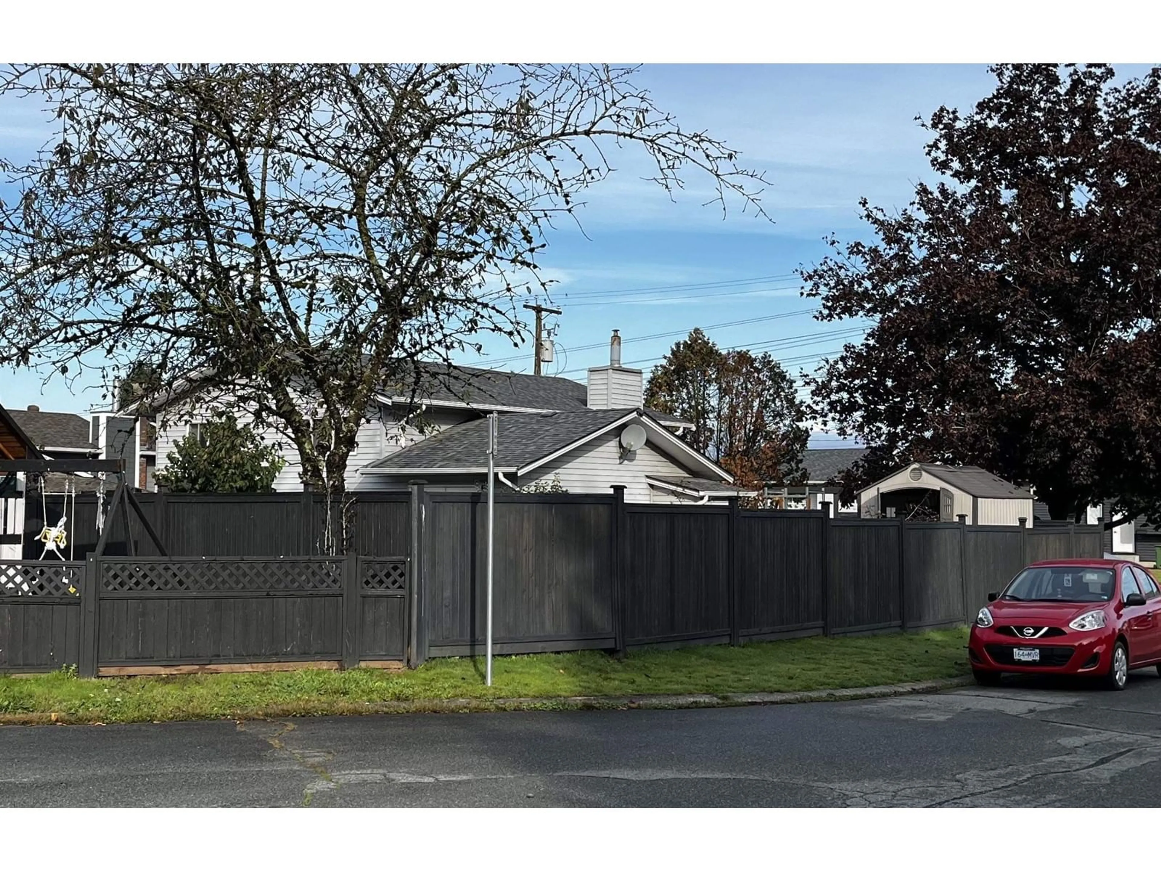 Frontside or backside of a home, the fenced backyard for 35086 CASSIAR AVENUE, Abbotsford British Columbia V2S5R5