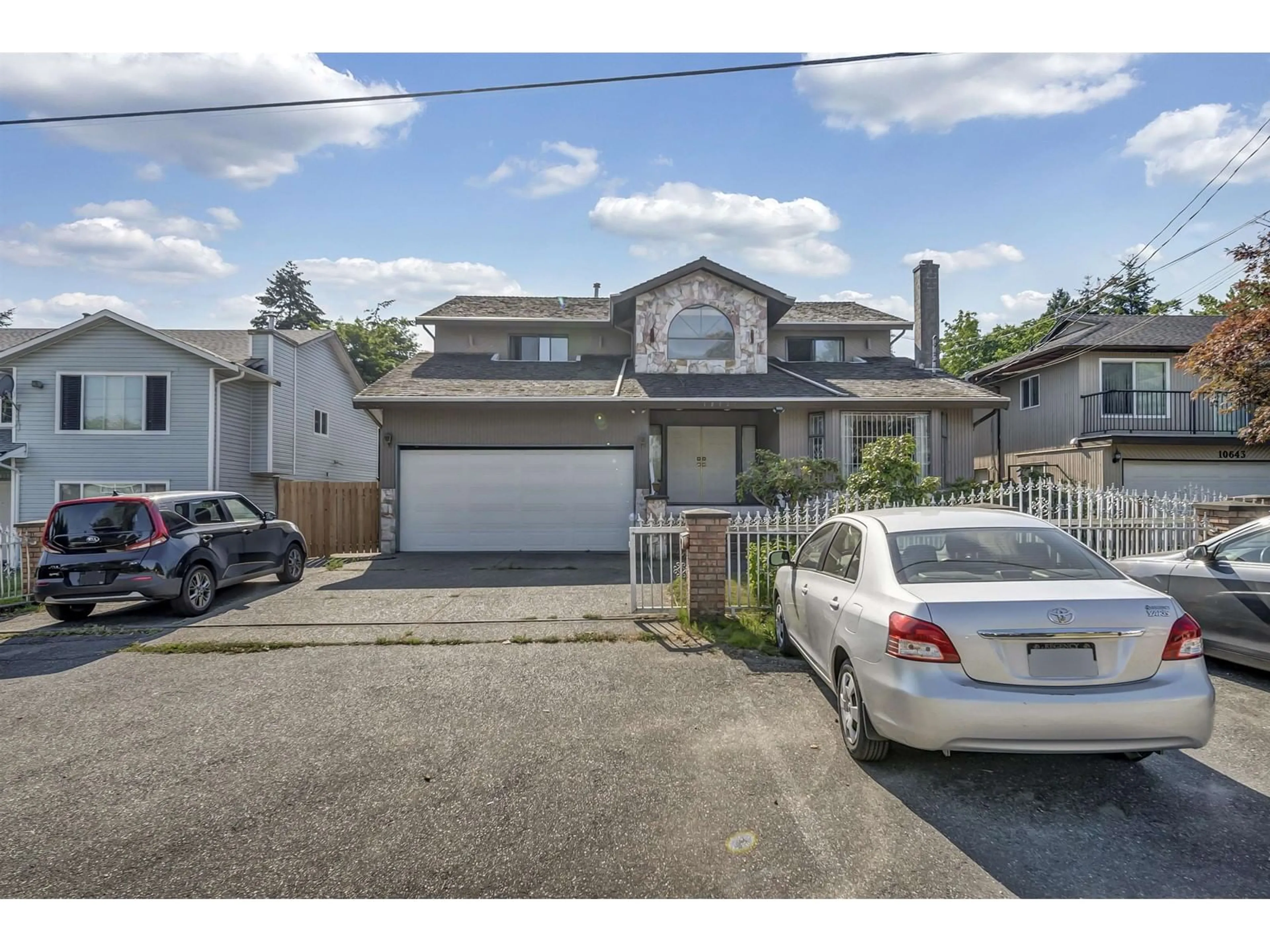 A pic from outside/outdoor area/front of a property/back of a property/a pic from drone, street for 10627 138A, Surrey British Columbia V3T4L2