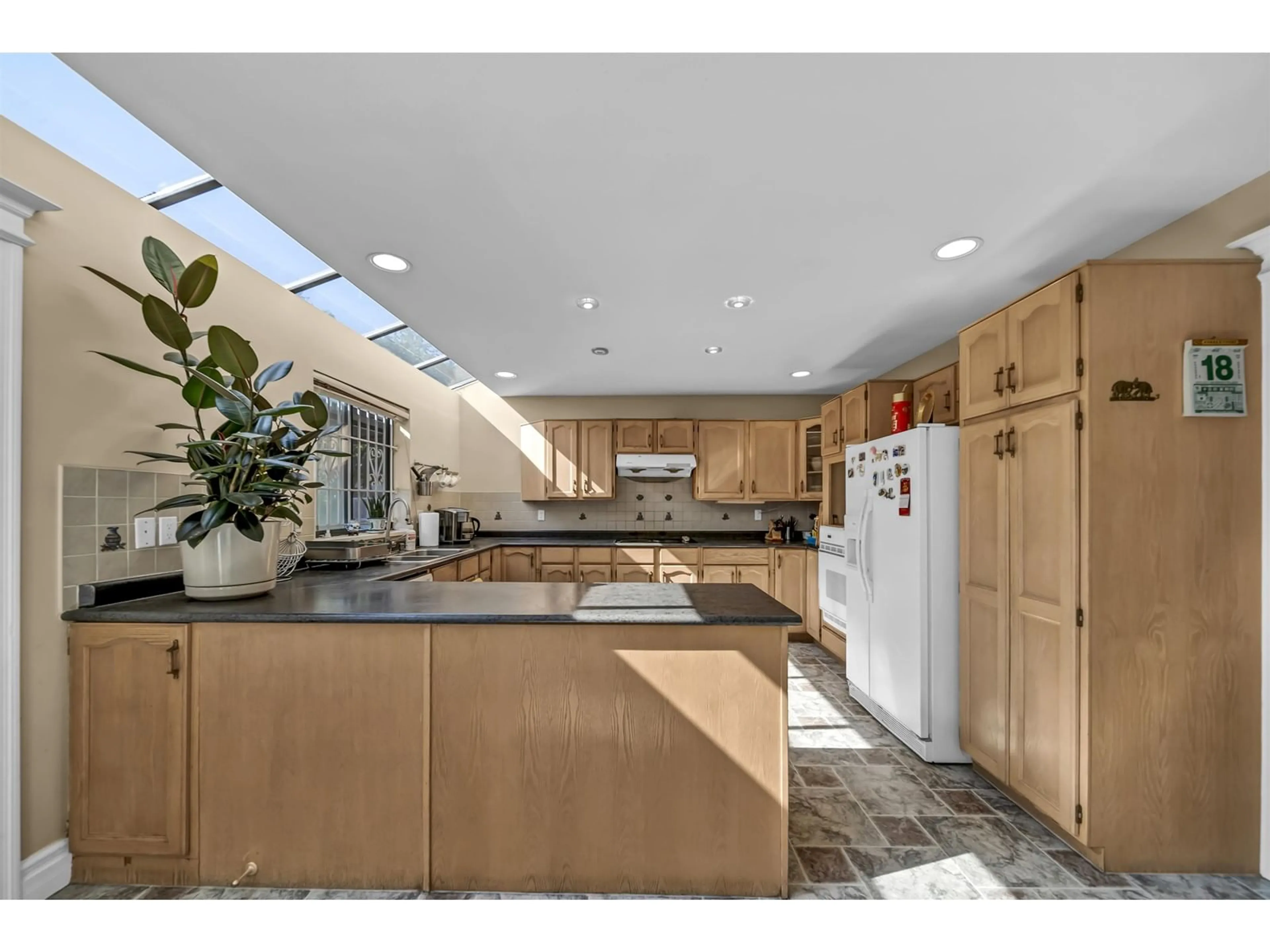Contemporary kitchen, ceramic/tile floor for 10627 138A, Surrey British Columbia V3T4L2