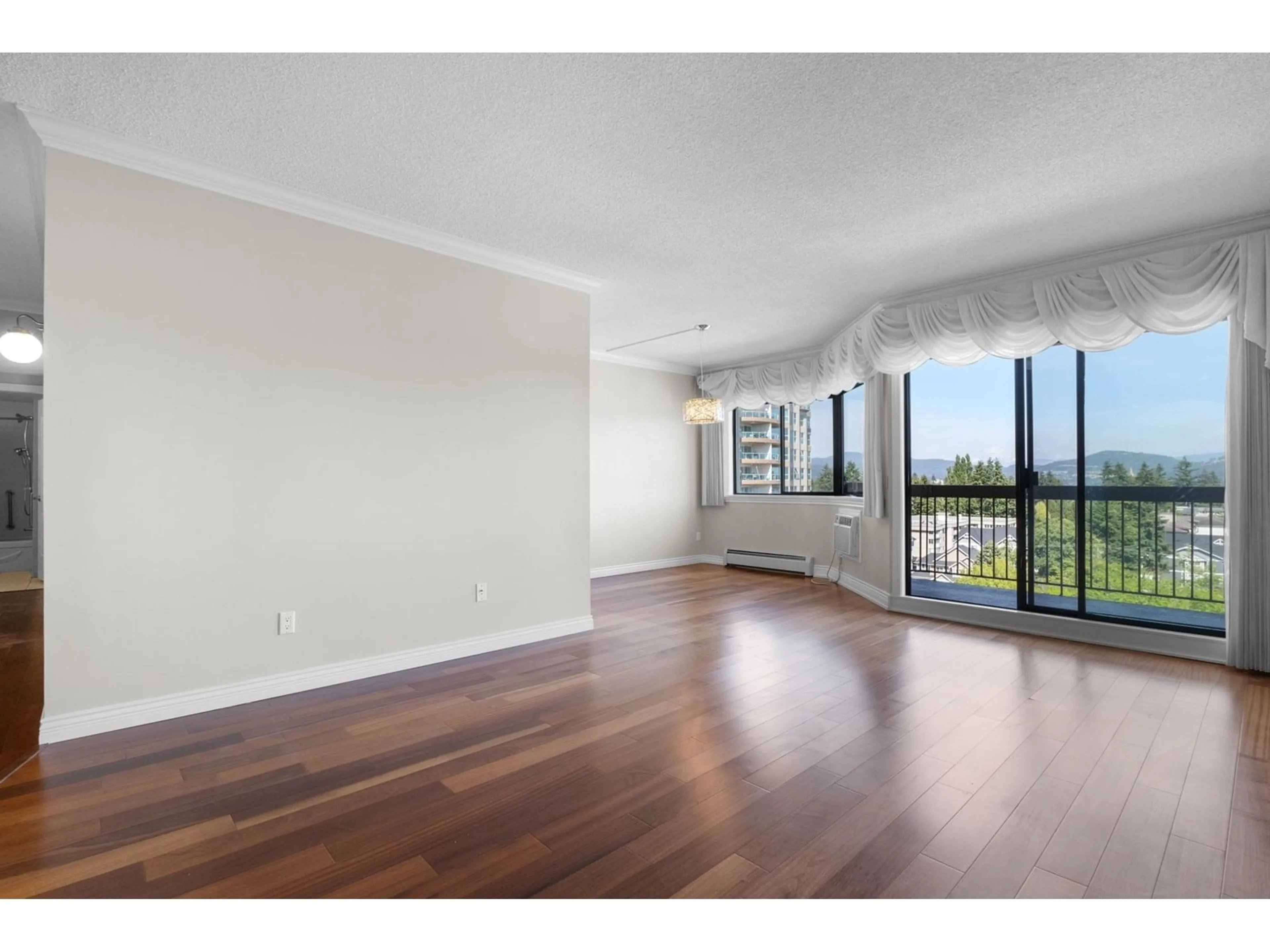 A pic of a room, wood floors for 919 31955 OLD YALE ROAD, Abbotsford British Columbia V2T4N1