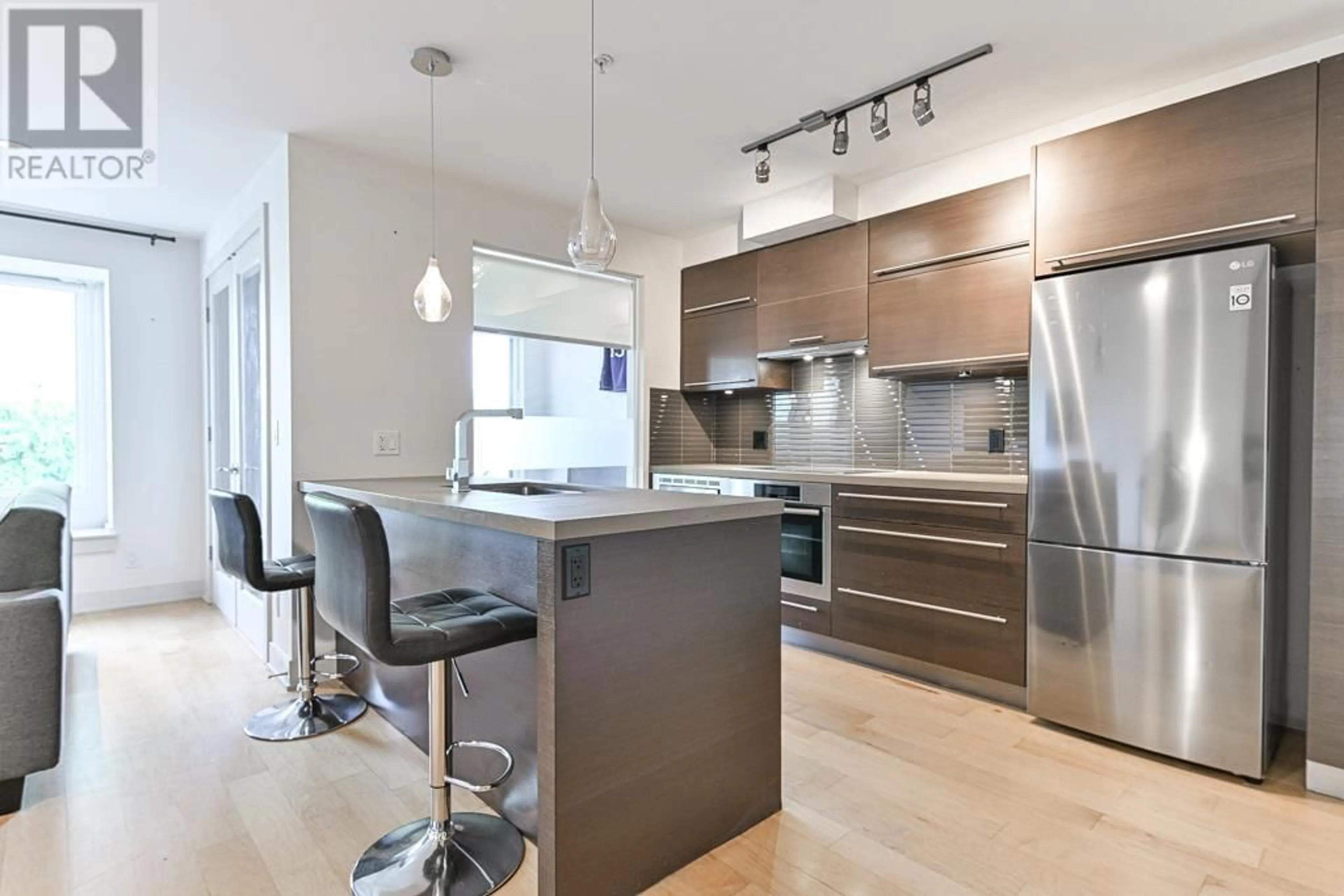 Contemporary kitchen, wood floors for 304 4463 W 10TH AVENUE, Vancouver British Columbia V6R2H8