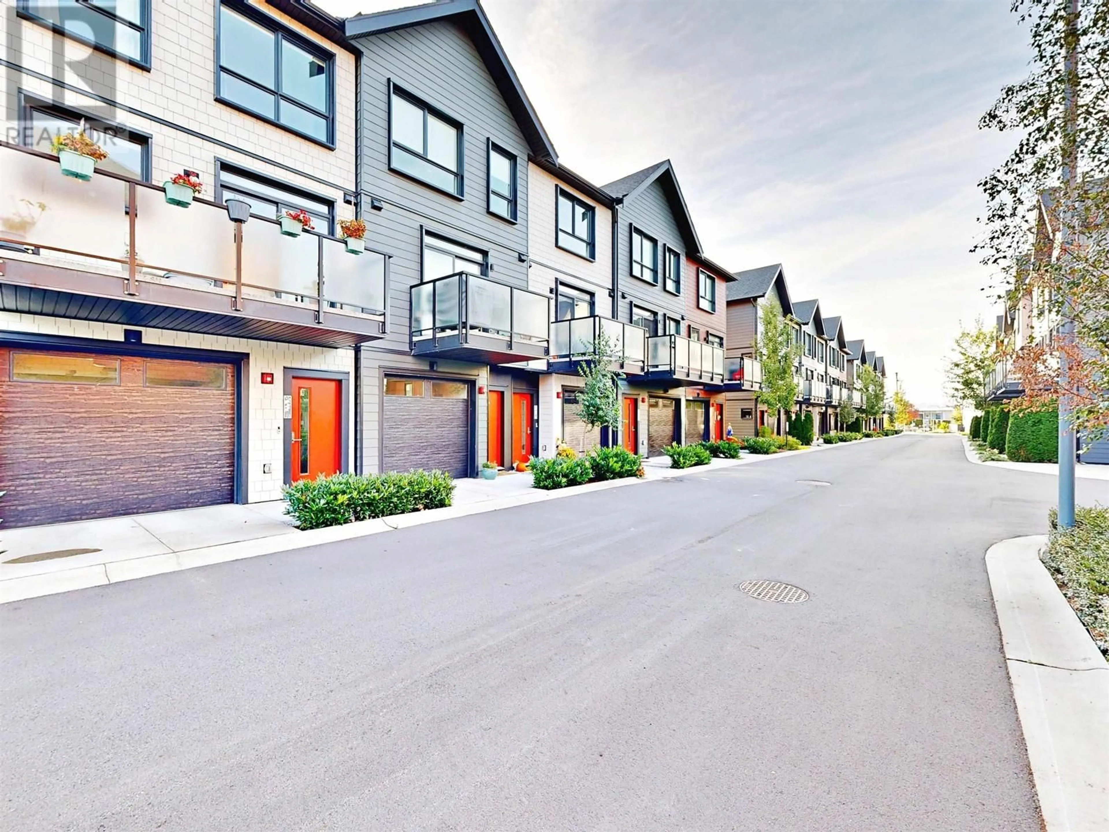 A pic from exterior of the house or condo, the street view for 113 4738 HEMLOCK WAY, Tsawwassen British Columbia V4M0E3