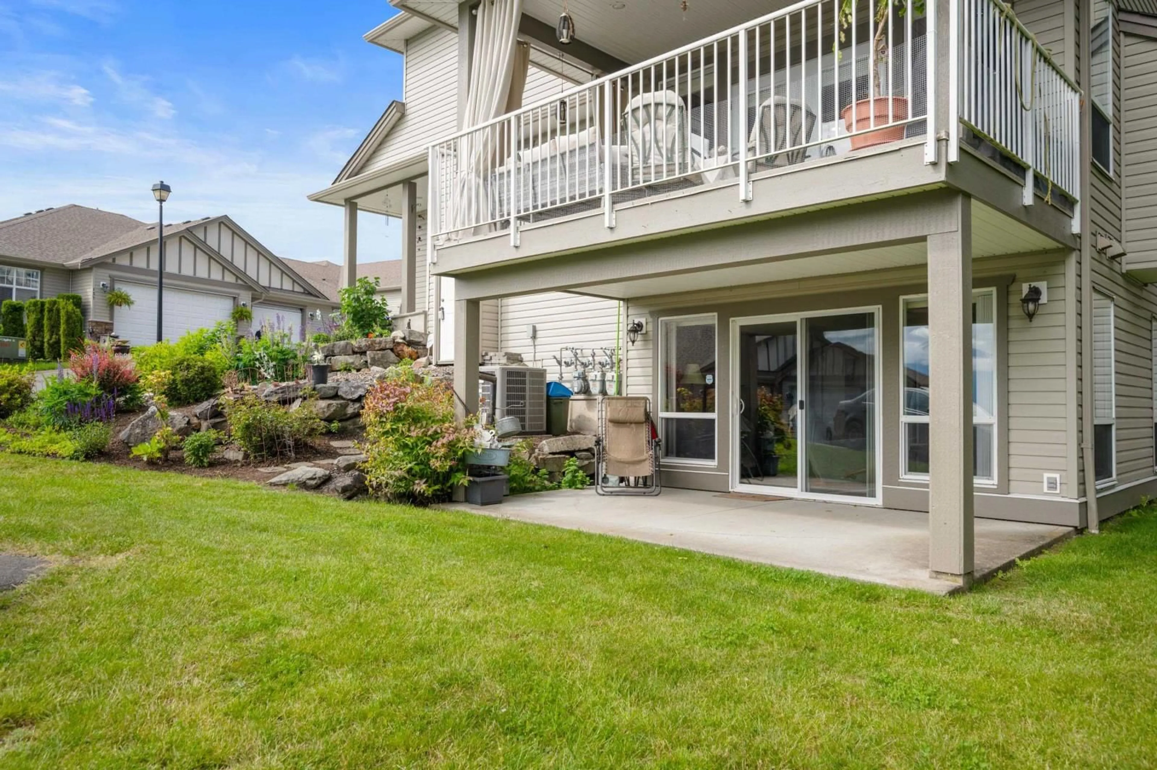 A pic from exterior of the house or condo, the fenced backyard for 140 8590 SUNRISE DRIVE, Chilliwack British Columbia V2R3Z4