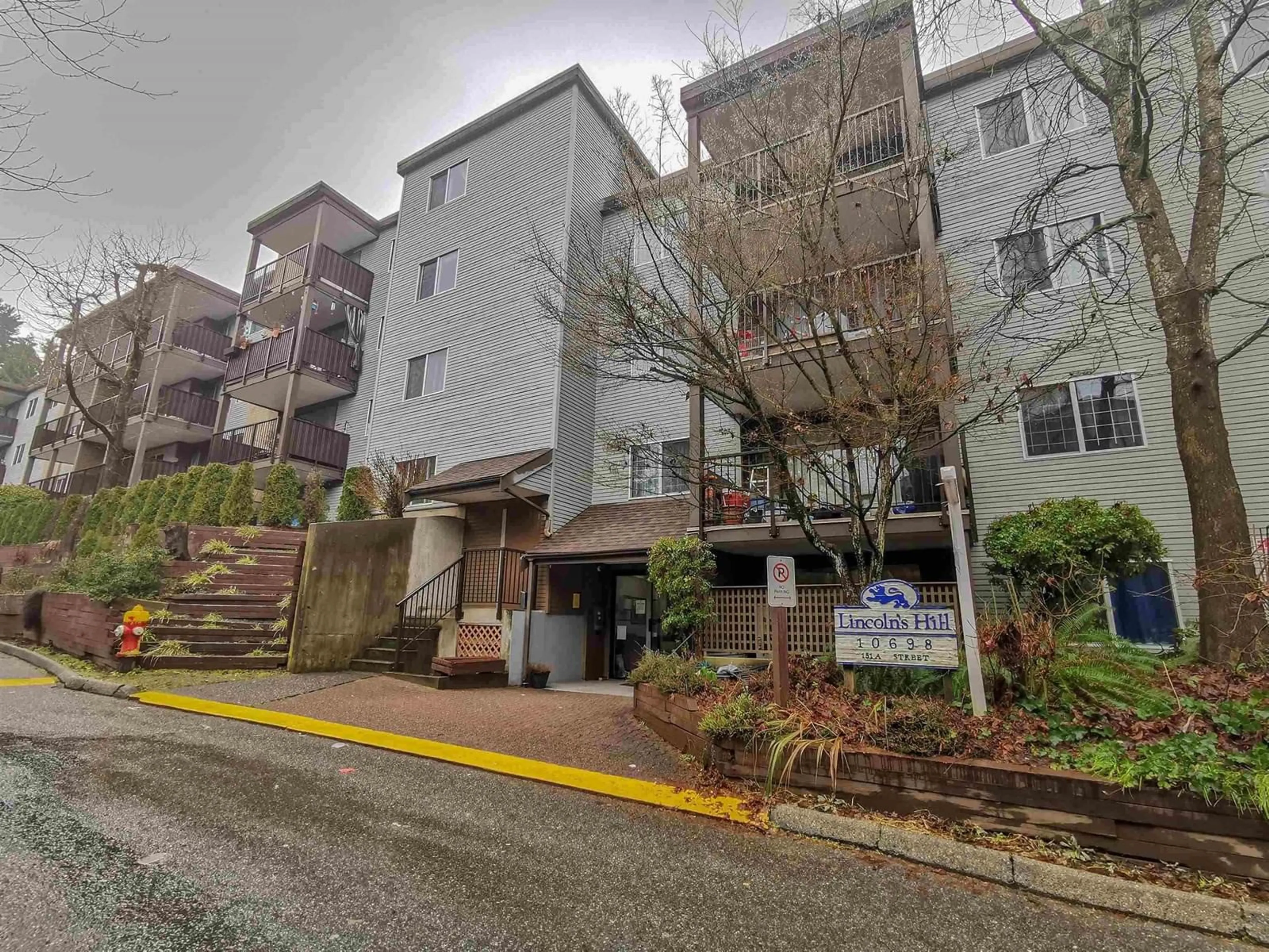 A pic from exterior of the house or condo, the street view for 107 10698 151A STREET, Surrey British Columbia V3R8T5