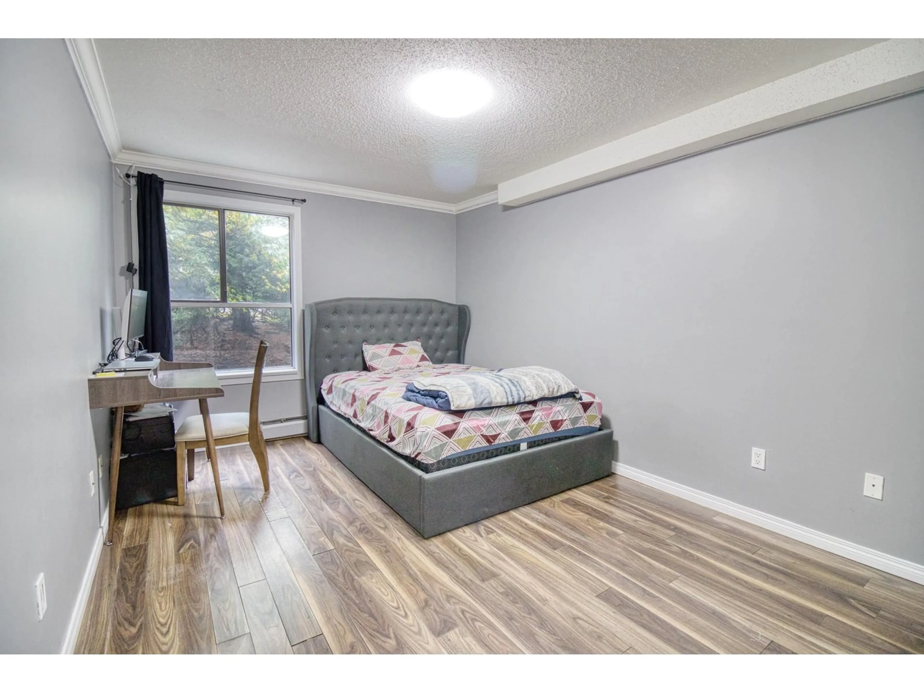 A pic of a room, wood floors for 107 10698 151A STREET, Surrey British Columbia V3R8T5