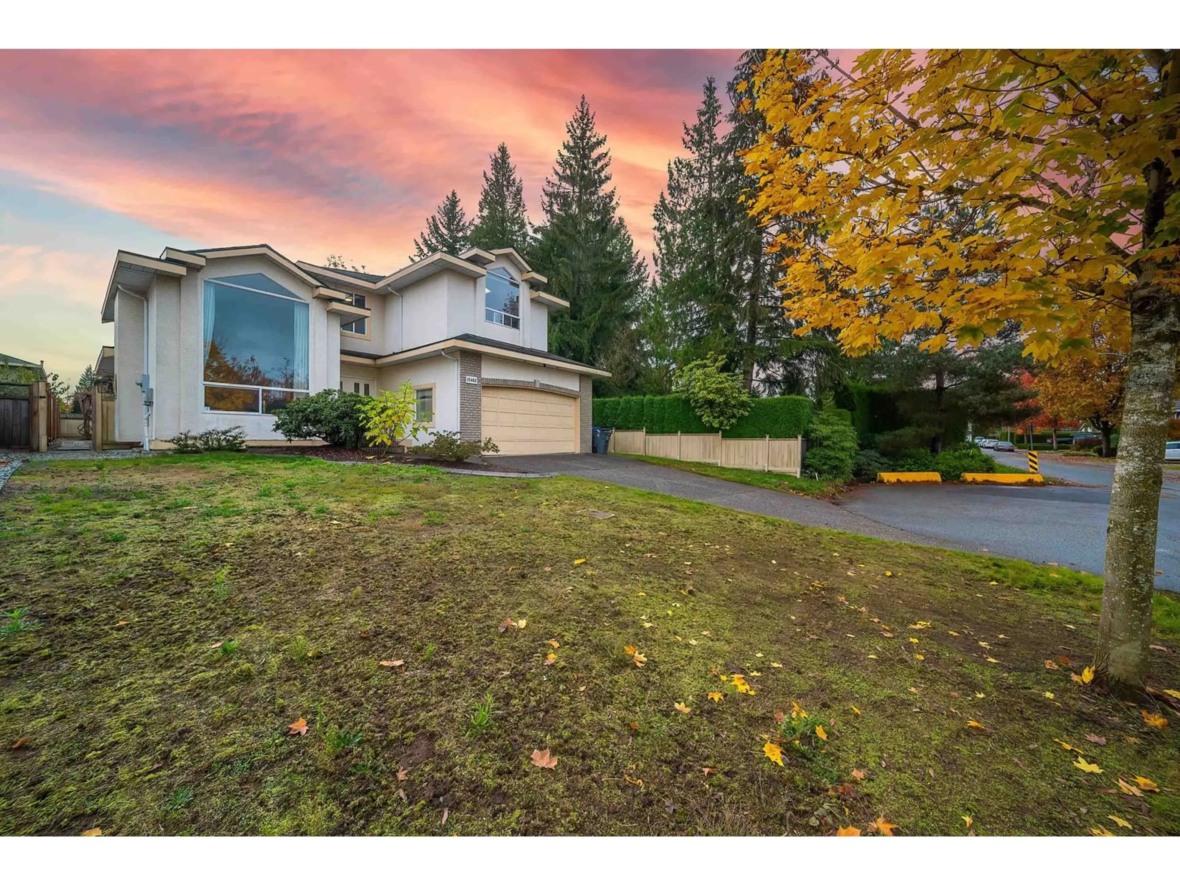 A pic from exterior of the house or condo, the fenced backyard for 15462 111A AVENUE, Surrey British Columbia V3R0J6