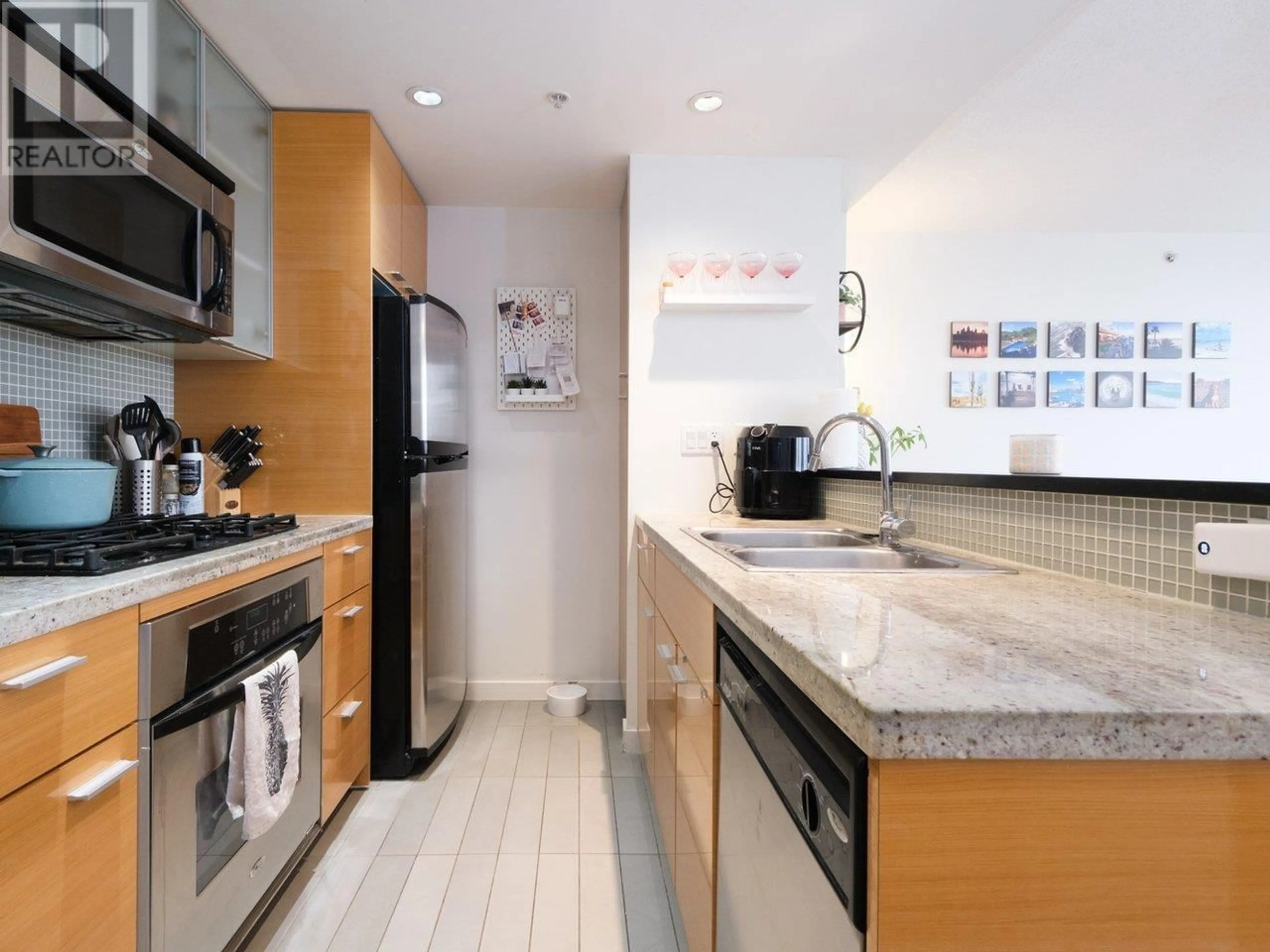 Contemporary kitchen, wood floors for 3101 33 SMITHE STREET, Vancouver British Columbia V6B0B5