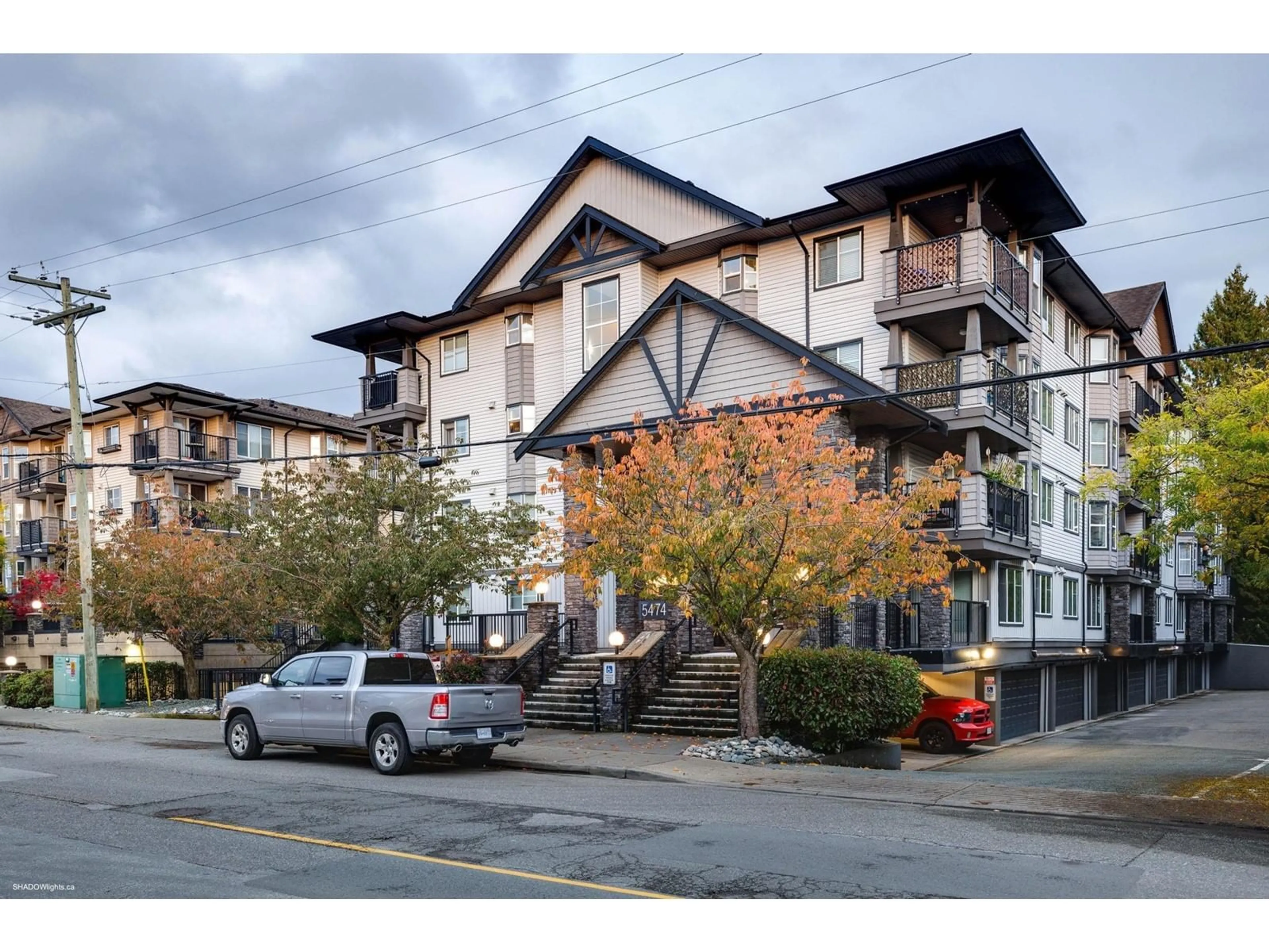 A pic from exterior of the house or condo, the street view for 405 5474 198 STREET, Langley British Columbia V3A1G2