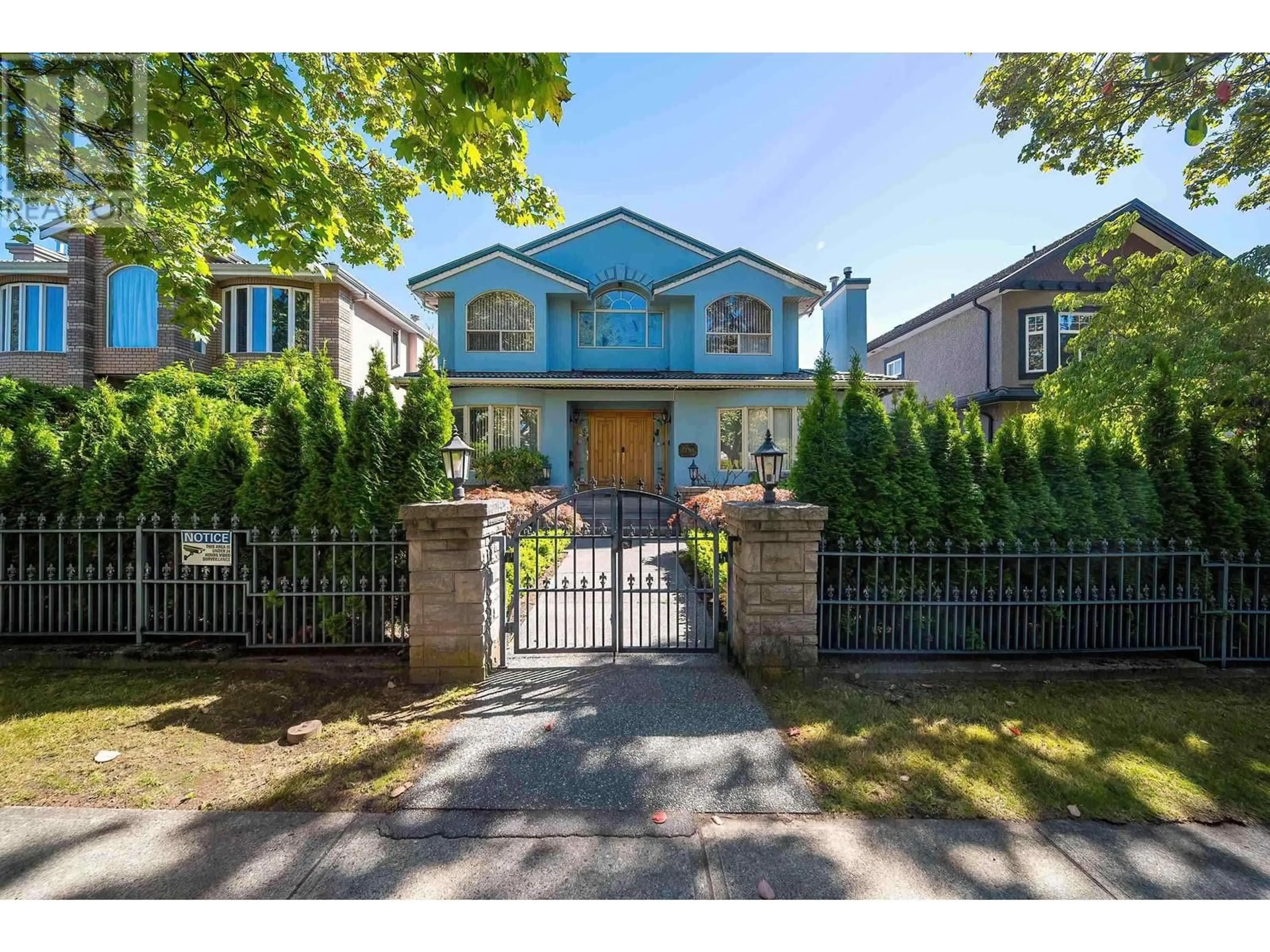 Frontside or backside of a home, the fenced backyard for 7738 HEATHER STREET, Vancouver British Columbia V6P3R4