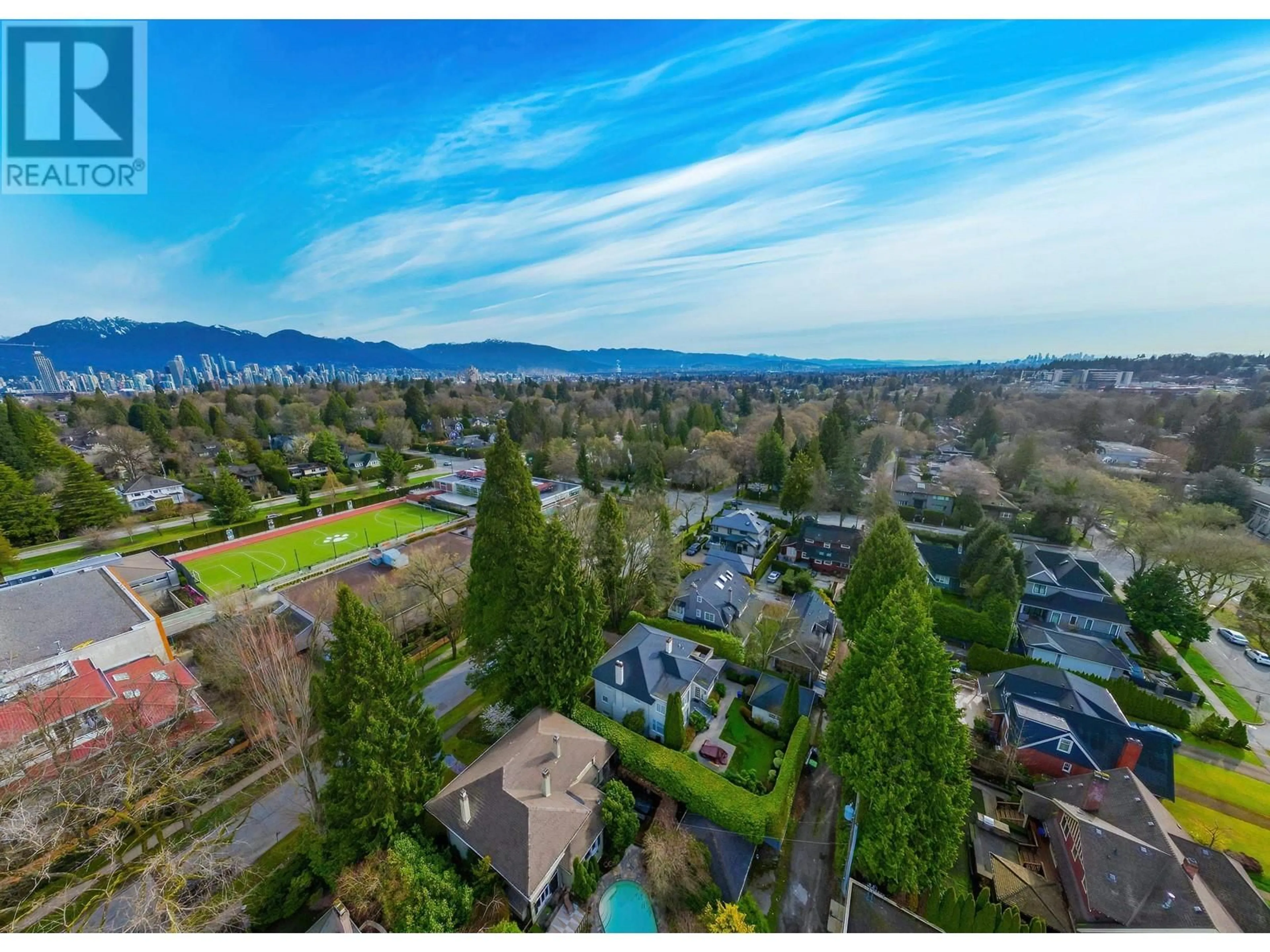 A pic from exterior of the house or condo, the fenced backyard for 1564 W 26TH AVENUE, Vancouver British Columbia V6J2W9