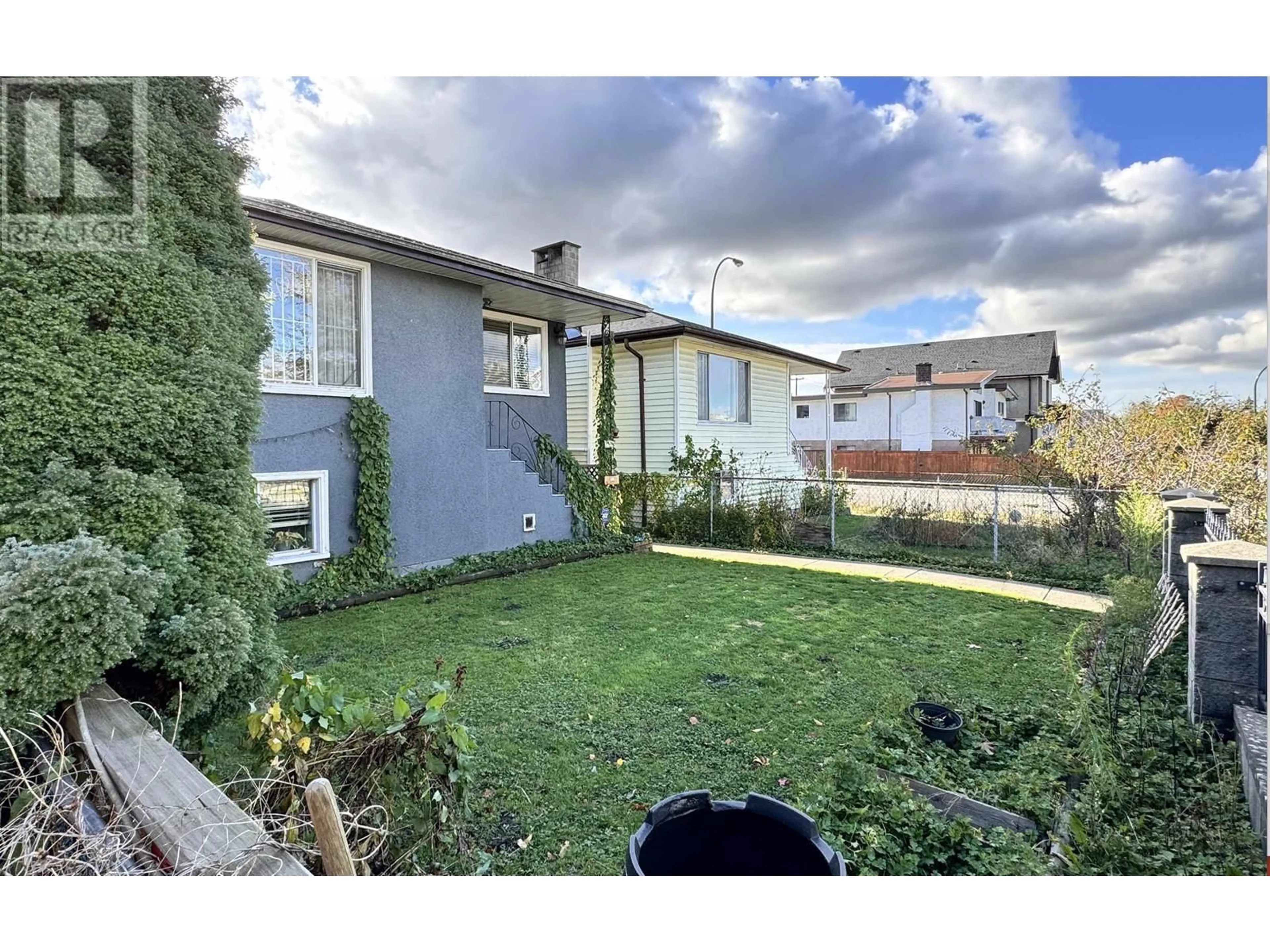 Frontside or backside of a home, the fenced backyard for 2324 E 30TH AVENUE, Vancouver British Columbia V5R2S1