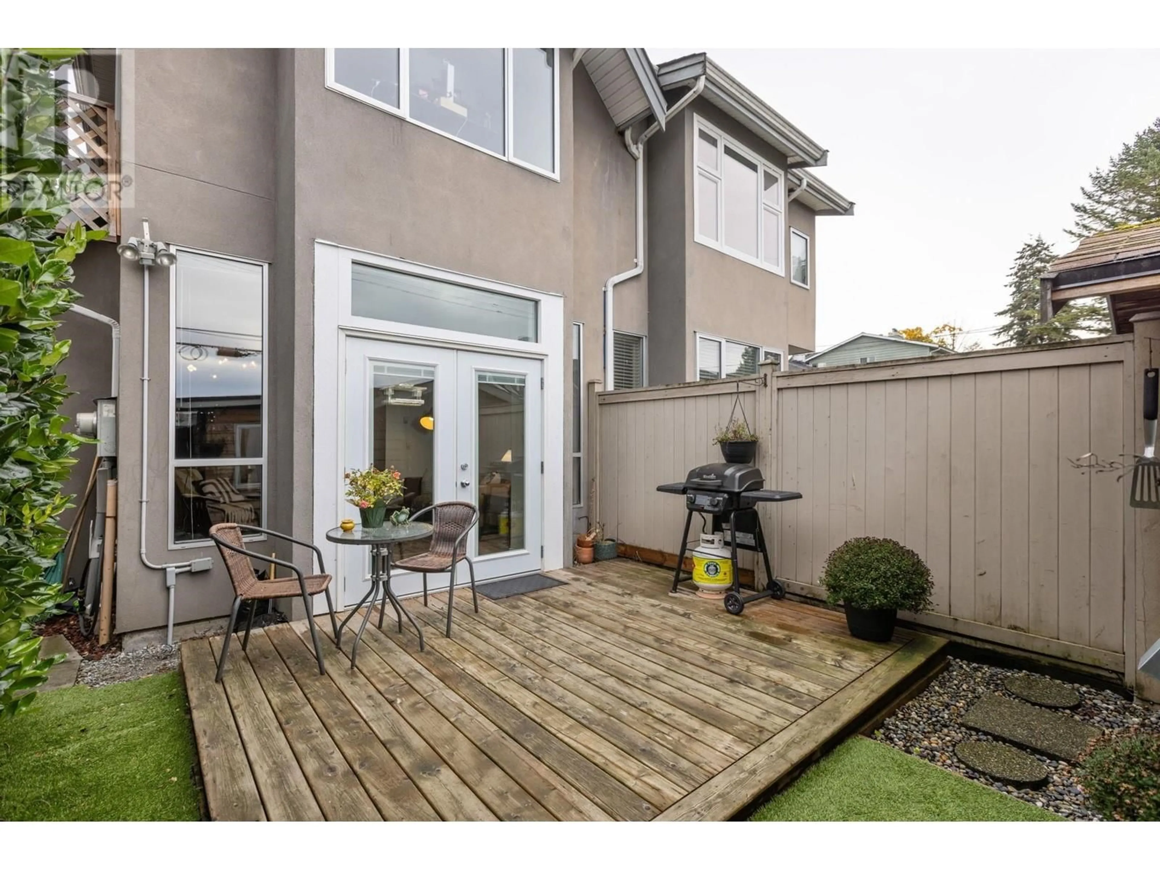 Patio, the fenced backyard for C 229 W 5TH STREET, North Vancouver British Columbia V7M1J9