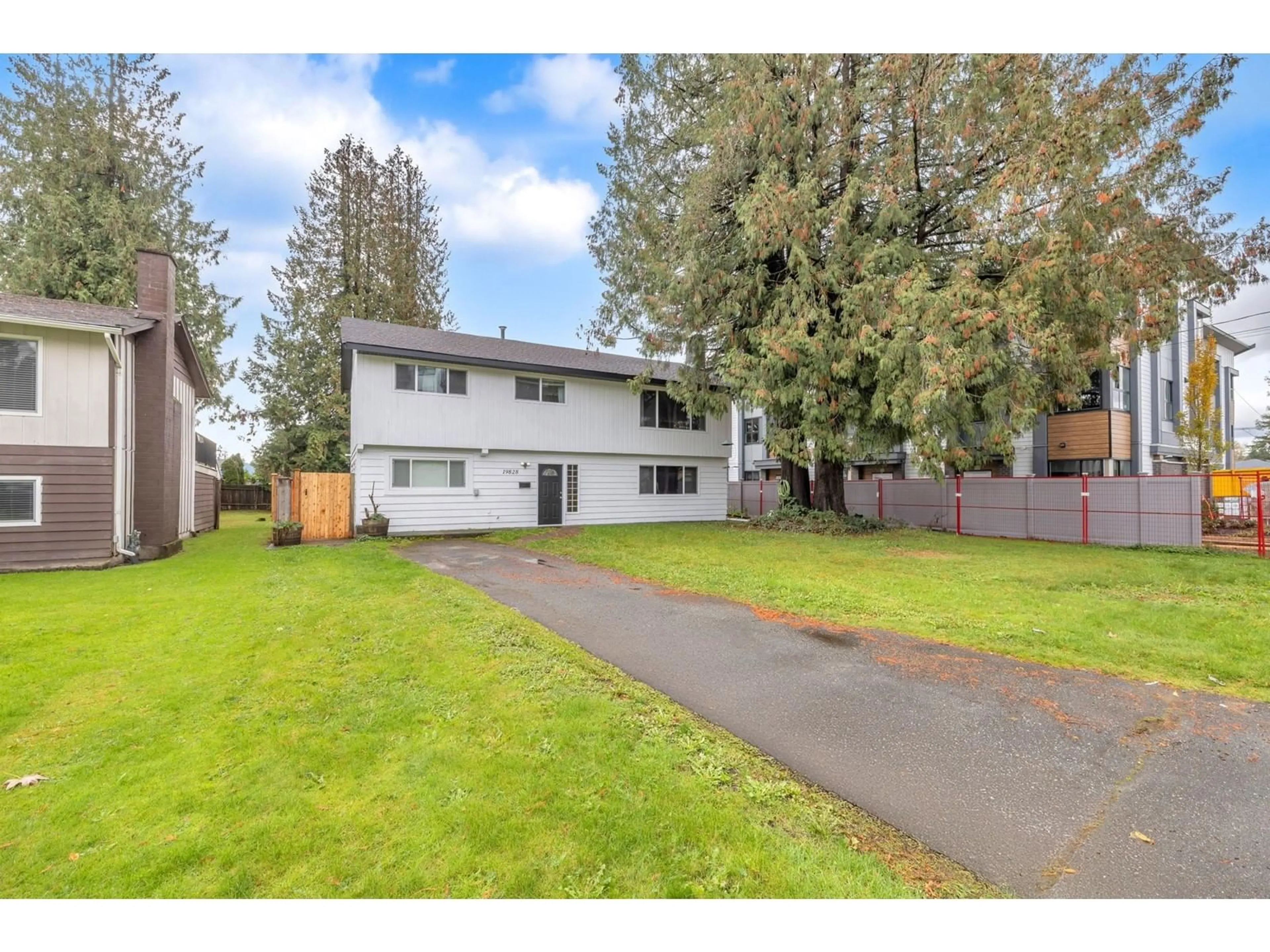 Frontside or backside of a home, the fenced backyard for 19828 54 AVENUE, Langley British Columbia V3A3V9