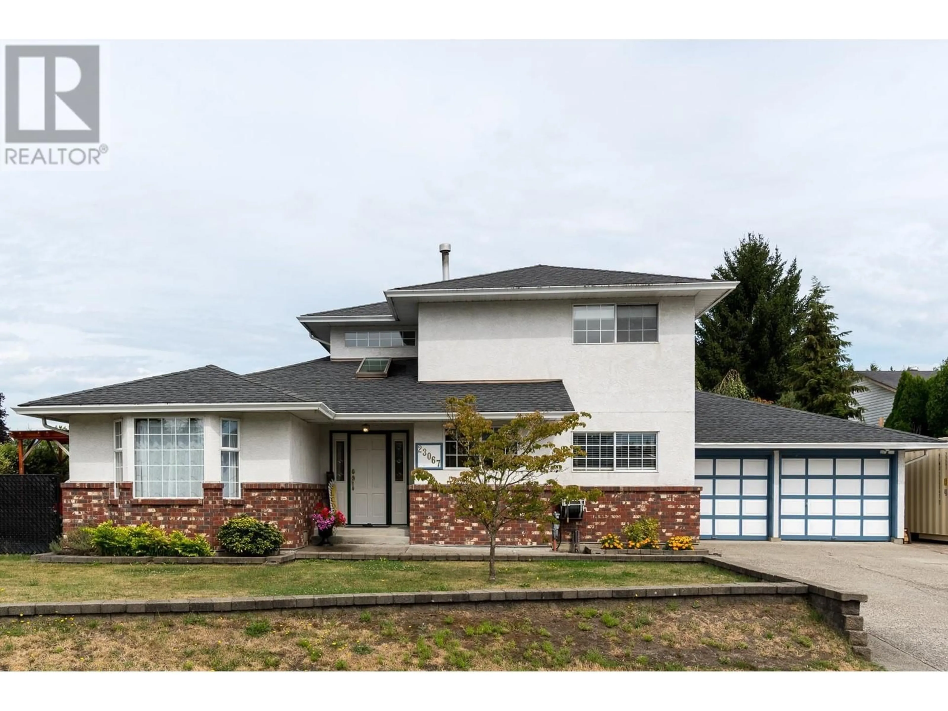 Frontside or backside of a home, the street view for 23067 EAGLE AVENUE, Maple Ridge British Columbia V2X0B5