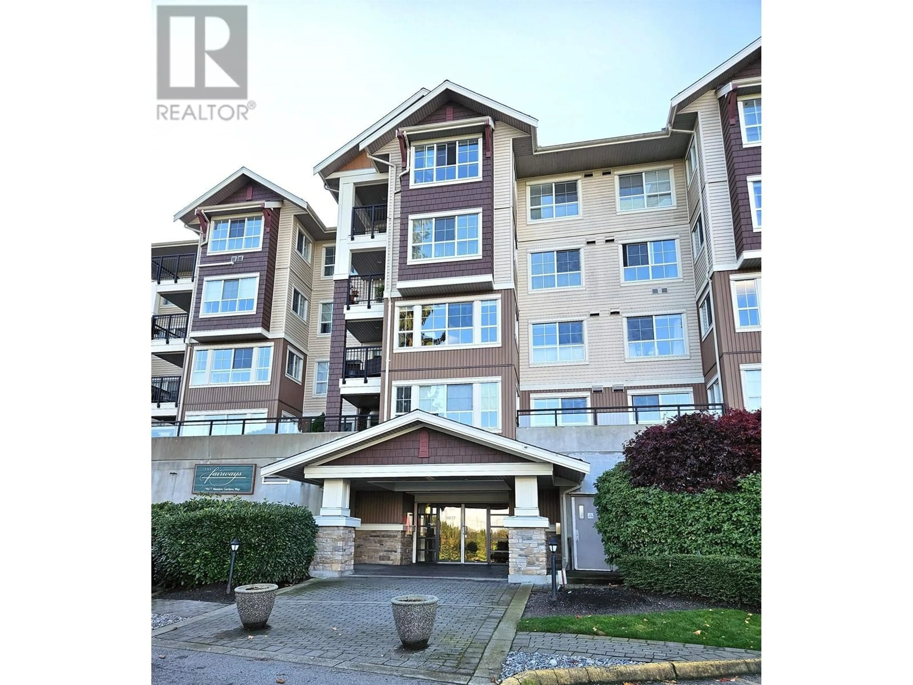 A pic from exterior of the house or condo, the front or back of building for 312 19677 MEADOW GARDENS WAY, Pitt Meadows British Columbia V3Y0A2