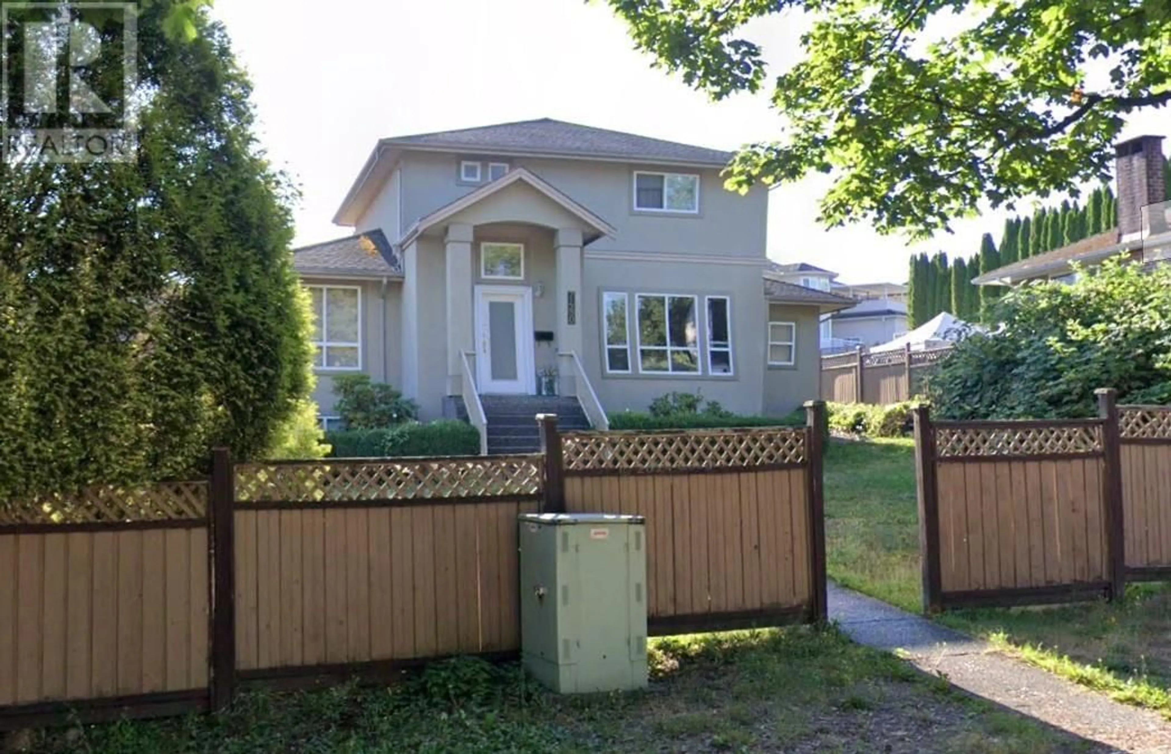 Frontside or backside of a home, the fenced backyard for 7480 CARIBOO ROAD, Burnaby British Columbia V3N4A7