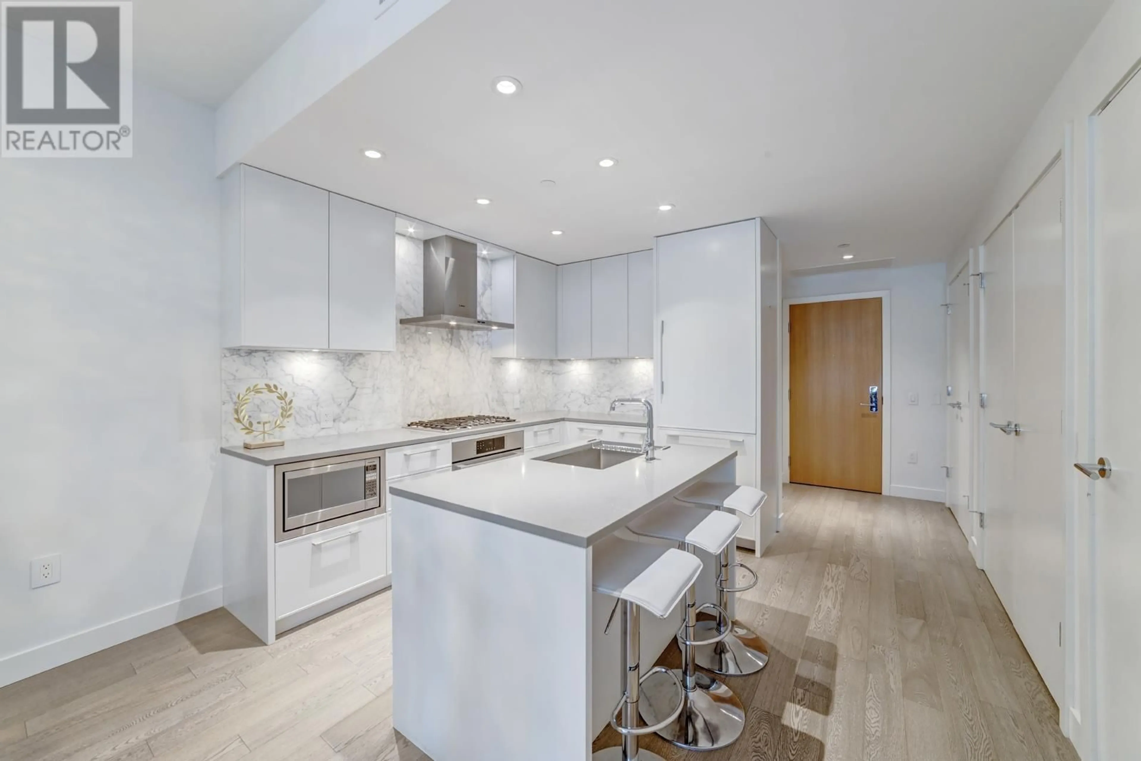 Contemporary kitchen, wood floors for 306 3220 CONNAUGHT CRESCENT, North Vancouver British Columbia V7R0A5